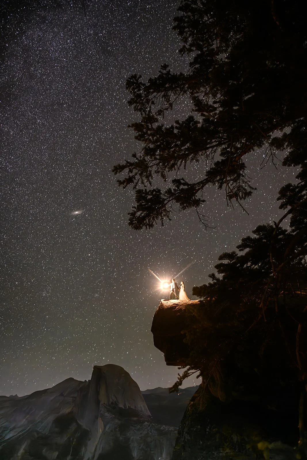 Wedding photos of a couple in Yosemite at night under a starry sky