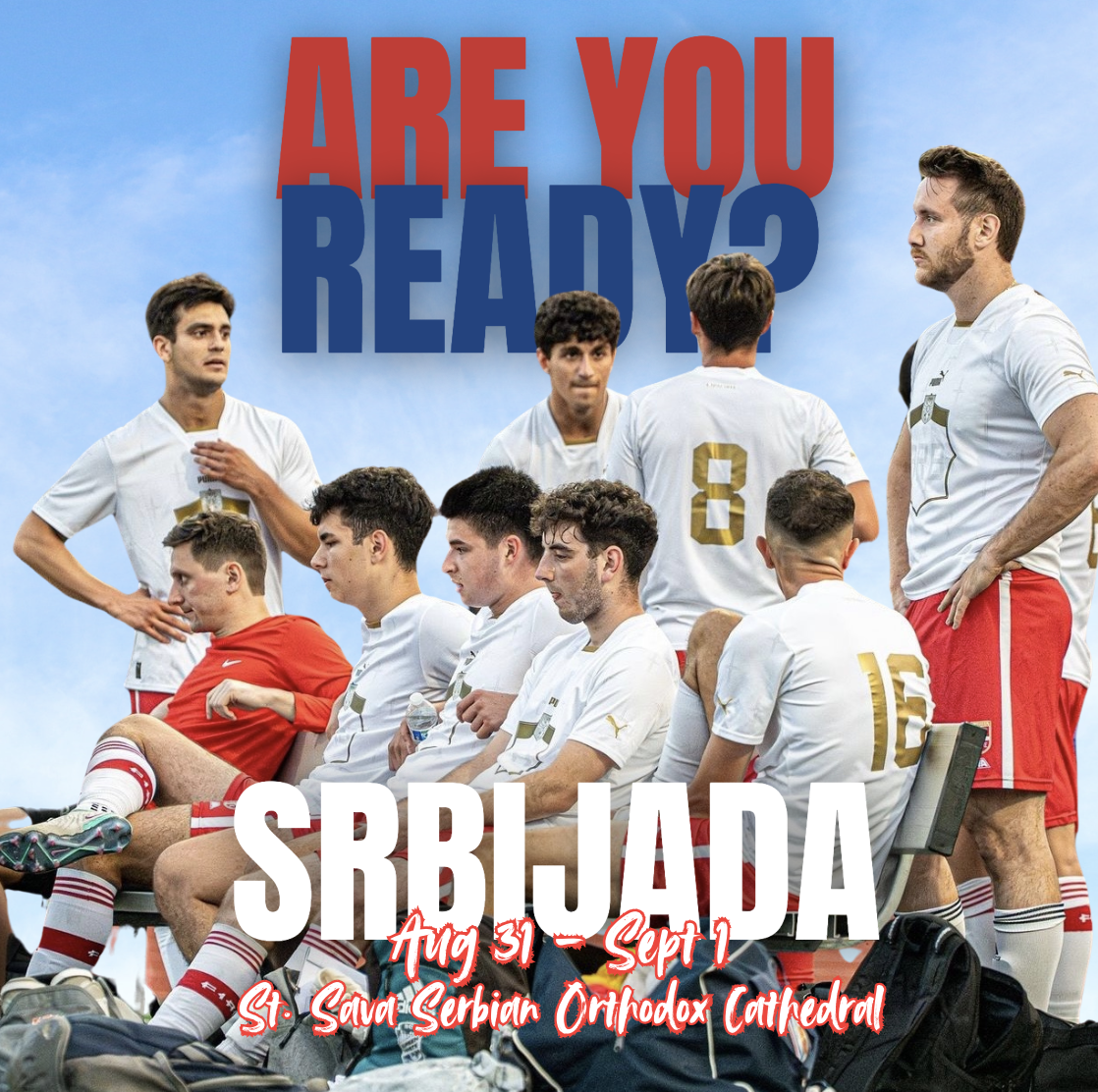 A group of young men in soccer uniforms, some sitting and some standing, with a large sign behind them that reads 'Are You Ready?' and text below indicating a soccer match between Serbia and another team, scheduled from August 31 to September 1 at St