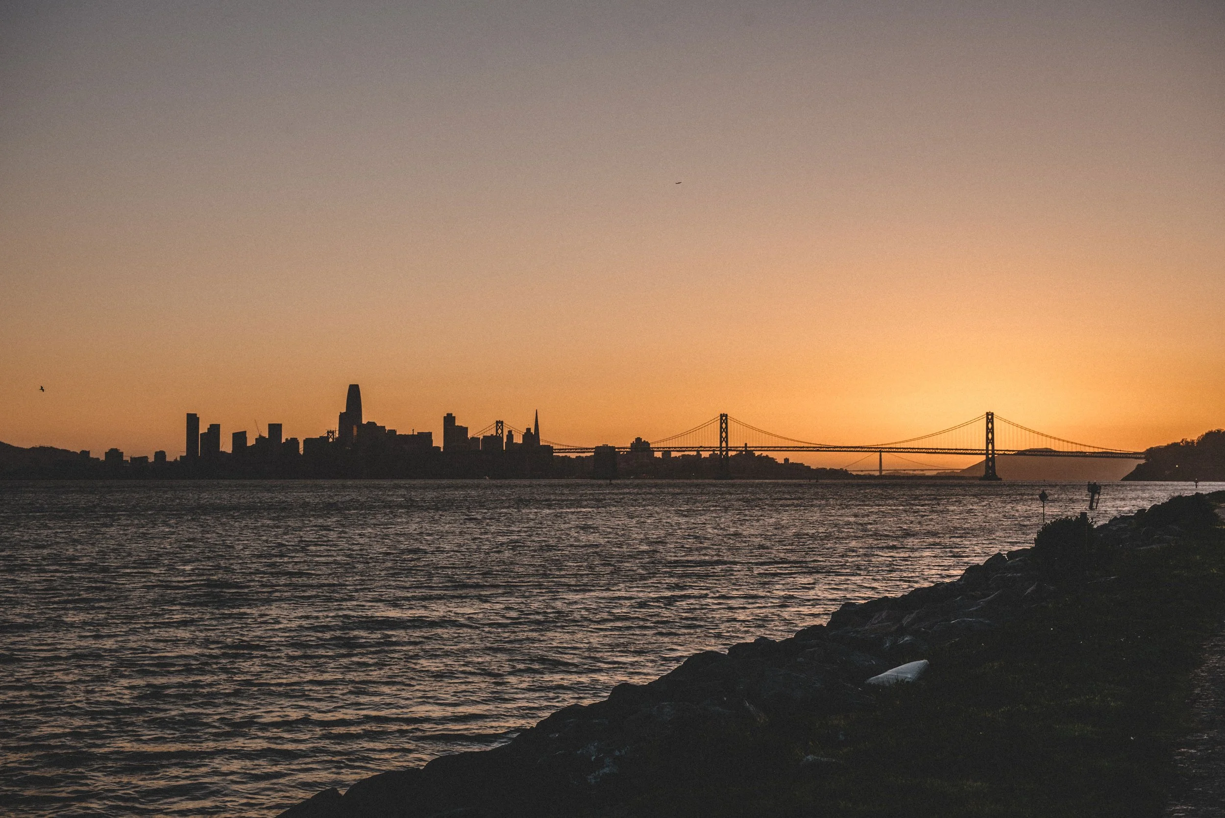 Photo of SF Bay Area during sunset where men in high performing environments burn out quickly.