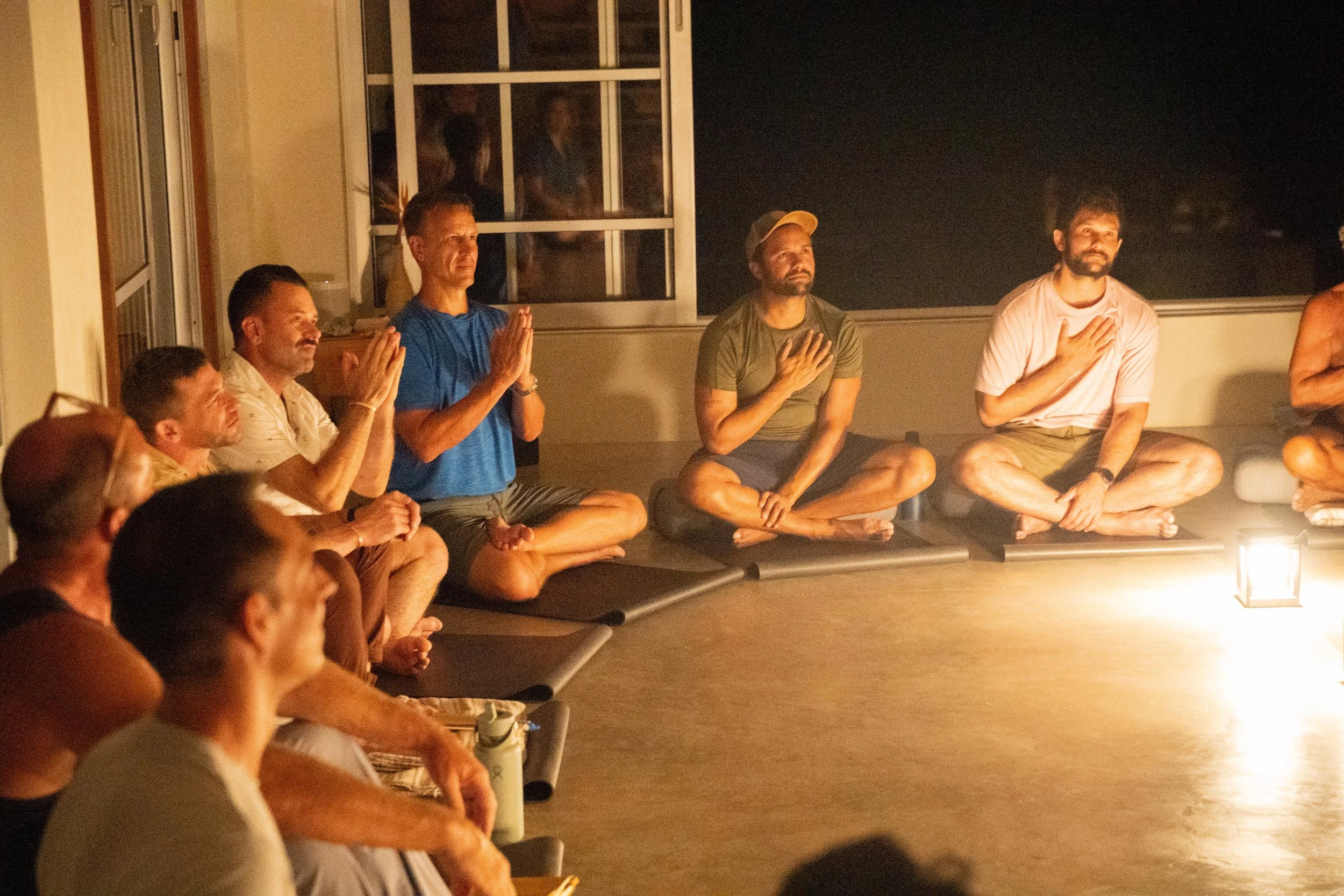 Evening men’s circle at SHIFT Men’s Retreat, a somatic retreat for men where honesty, connection, and support are central.