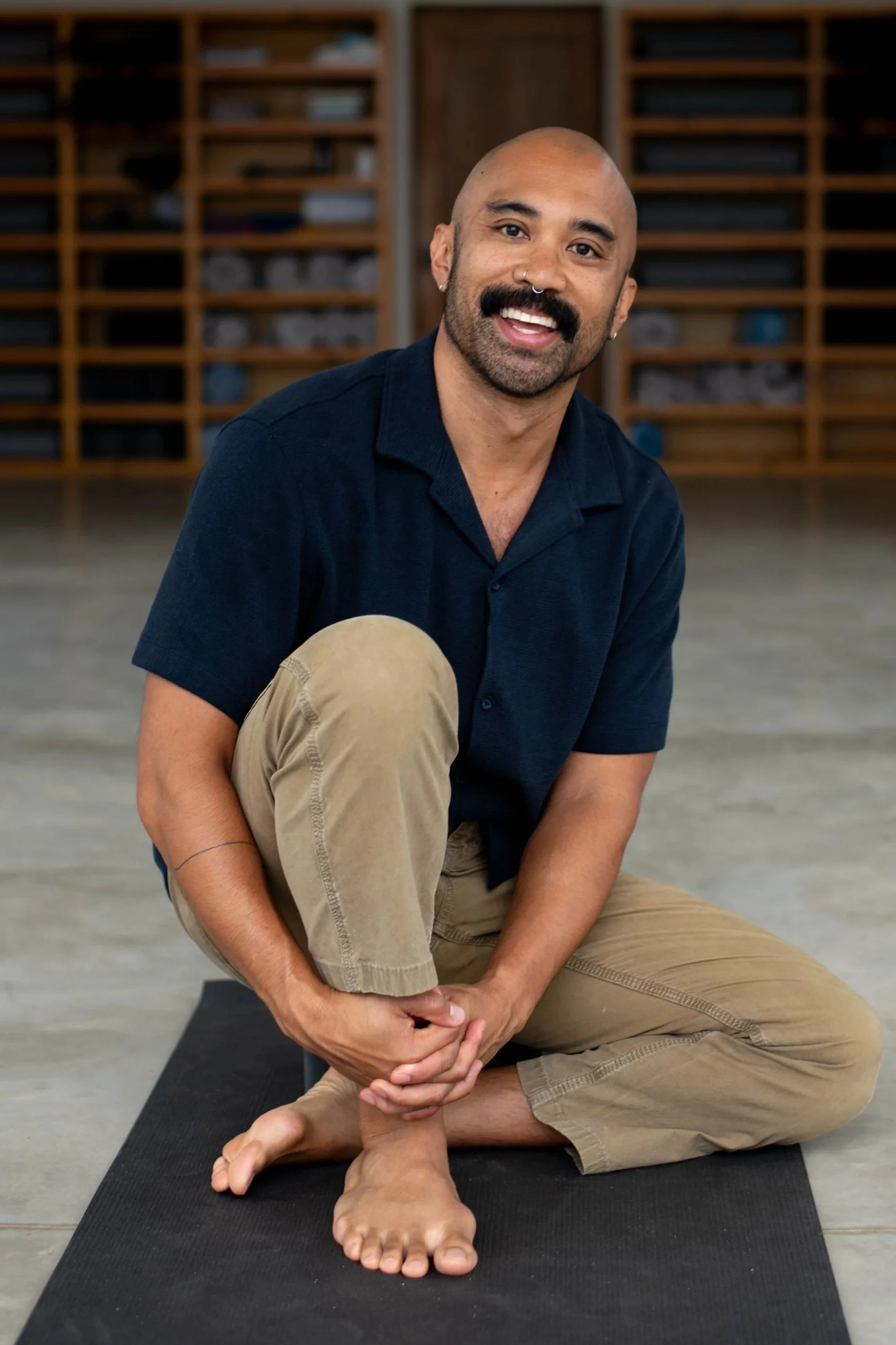 Somatic Men's Coach, Mike Sagun, gently smiles at the camera at SHIFT Men's Retreat -- a Somatic Therapy Retreat for Men in Baja California, Mexico.
