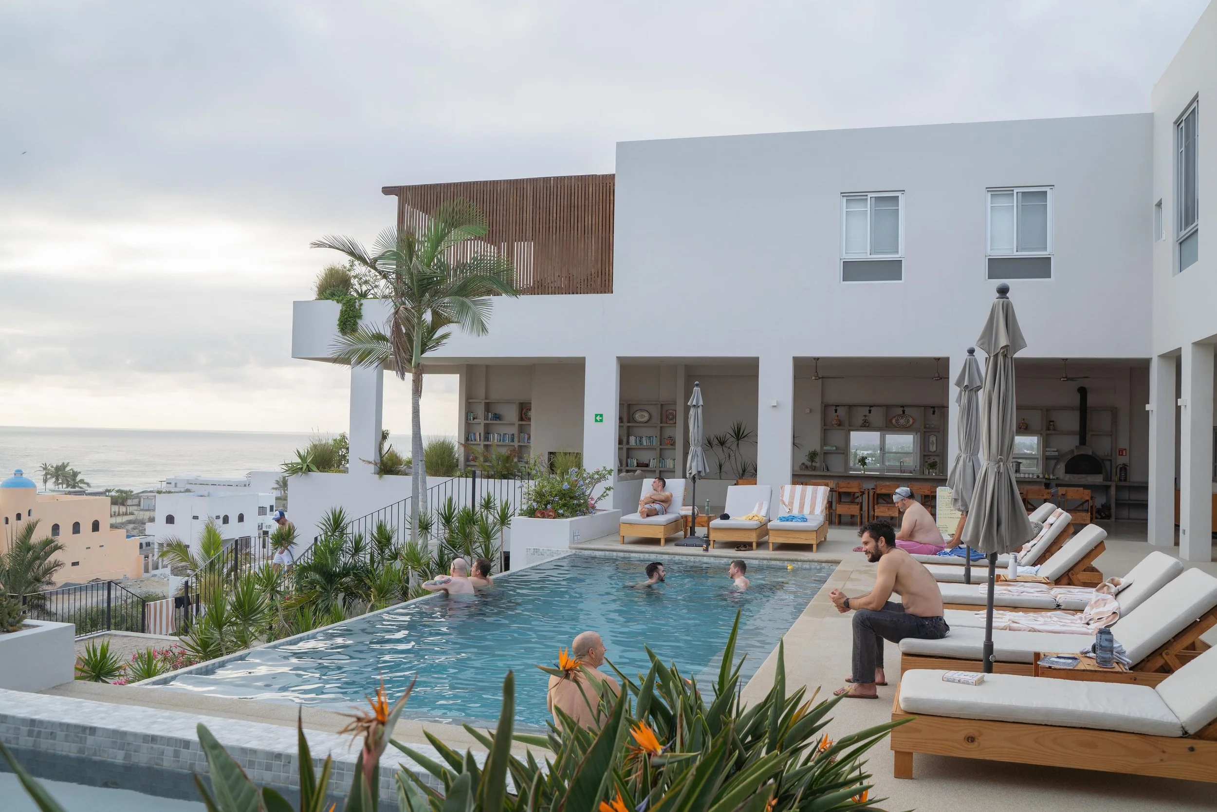 Participants at SHIFT Men's Retreat relax alone and hang out with each other during rest and restore time at this Somatic Men's Retreat.