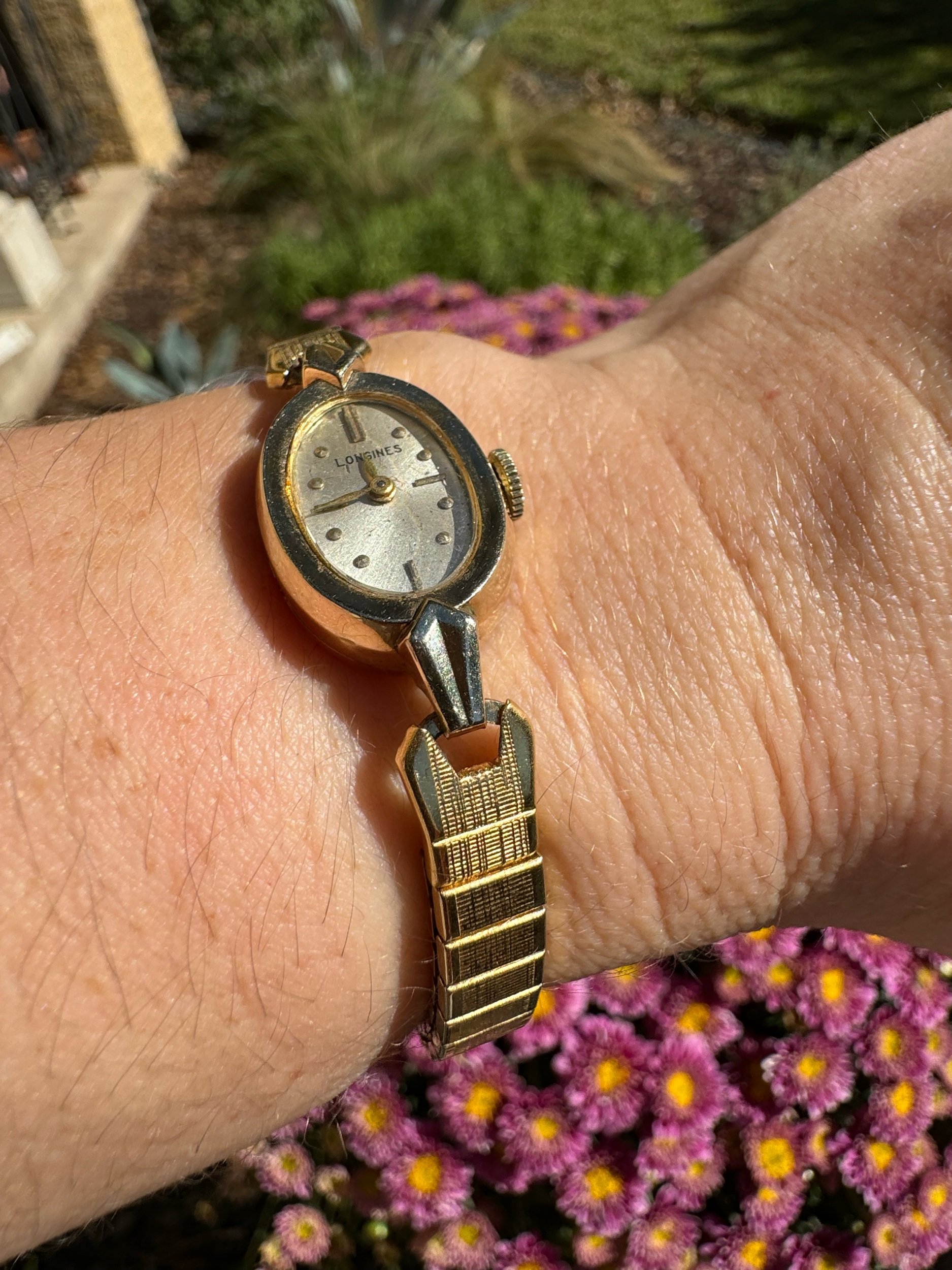Side view of Longines mechanical watch, highlighting luxurious gold casing and timeless style