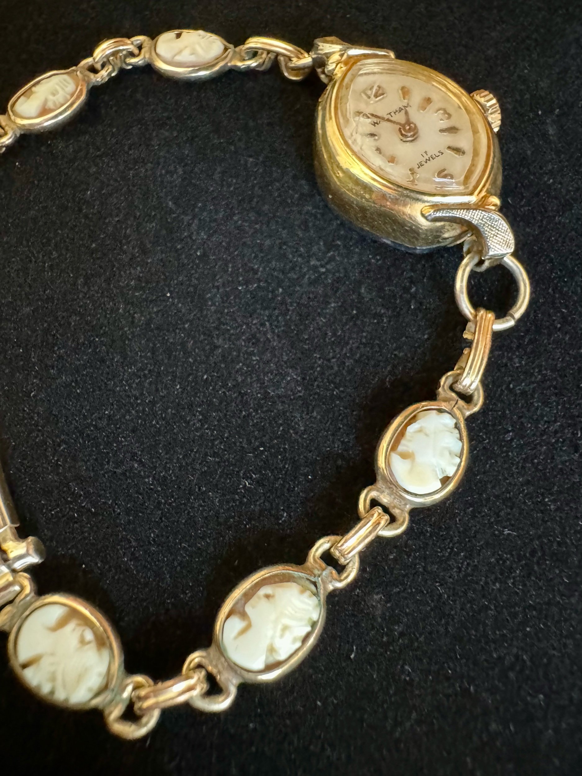 Vintage gold Waltman mechanical watch with elegant cameo band, a timeless piece for collectors