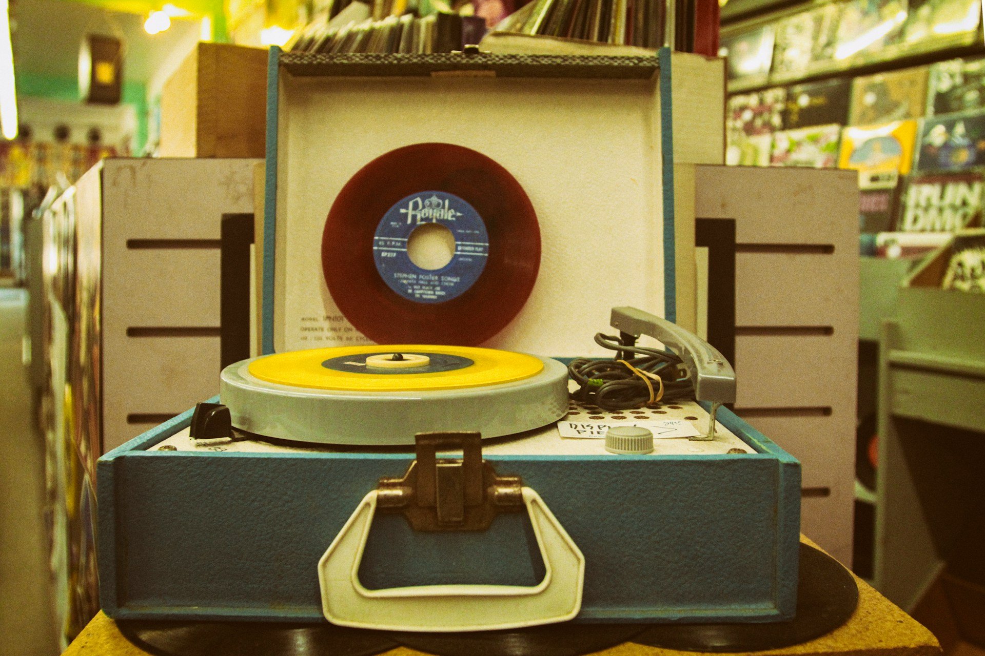 picture of old portable record player in record store