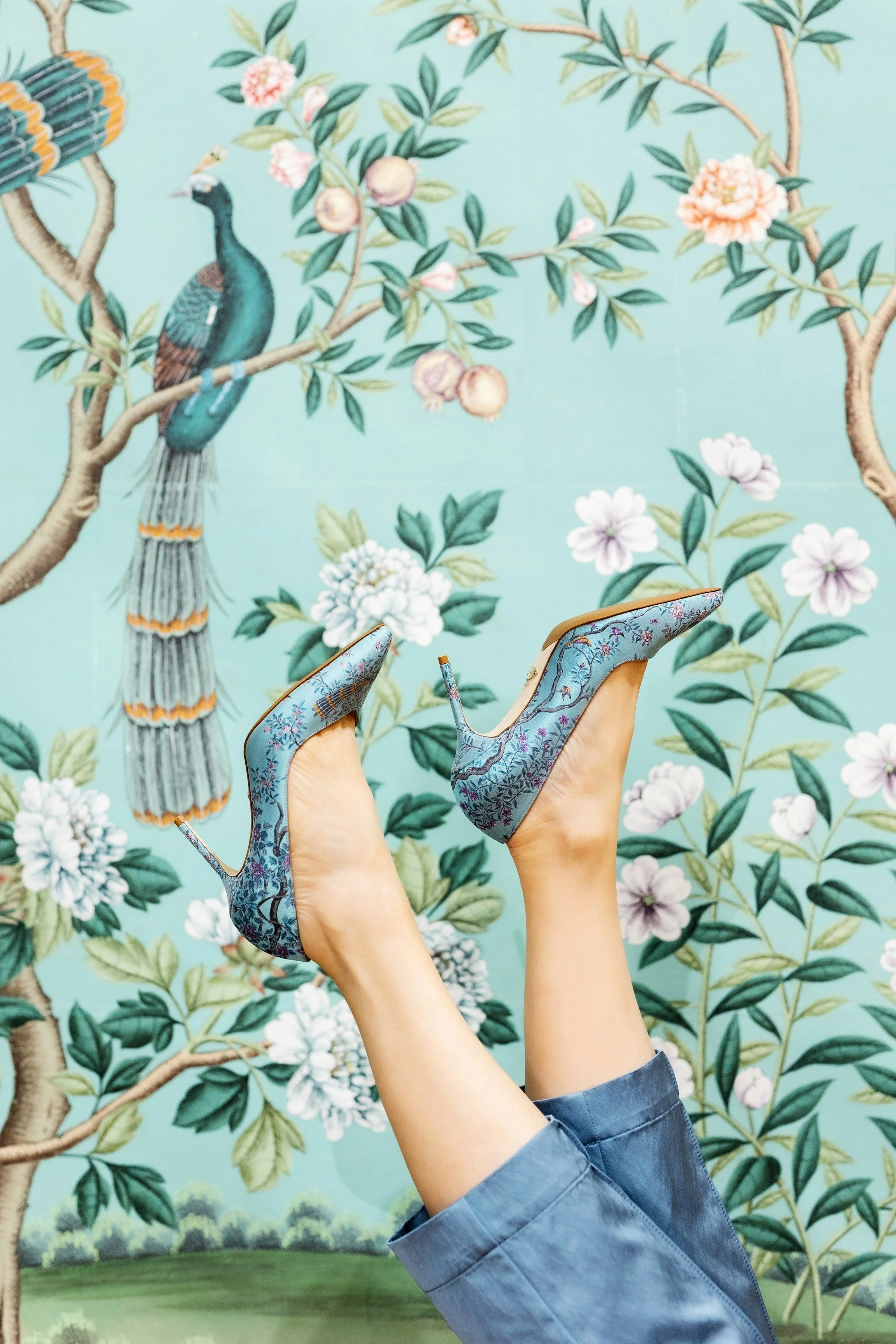 woman with heels kicked up