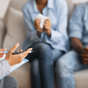 couple sitting on couch for therapy