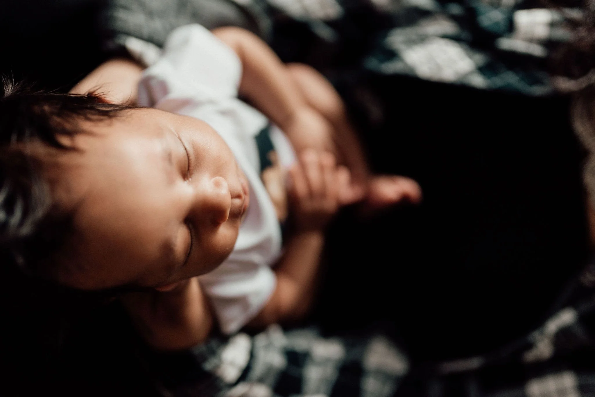 Postpartum doula supporting mother and newborn at home in San Bernardino County.