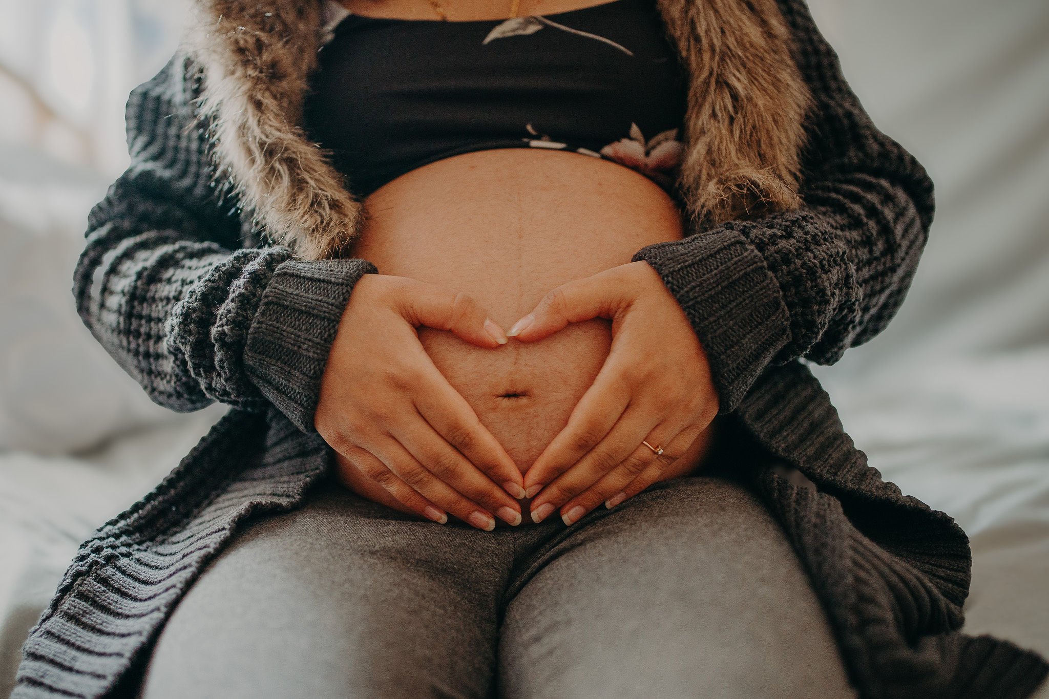 VBAC doula helping parents prepare for vaginal birth after cesarean during prenatal visit