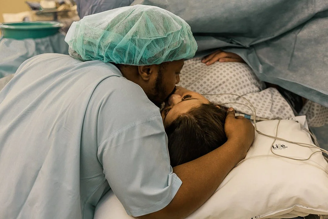 Birth doula providing continuous labor support in Inland Empire hospital setting.