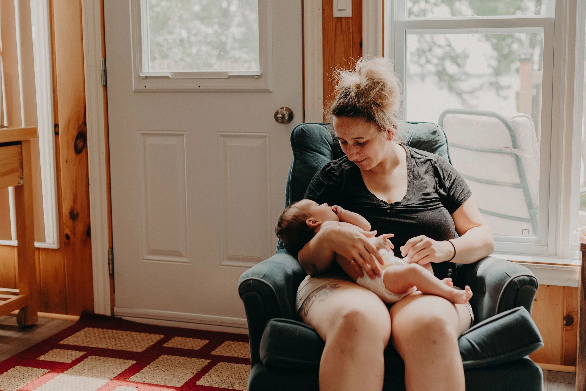 Birth doula supporting laboring mother in Riverside County hospital setting.