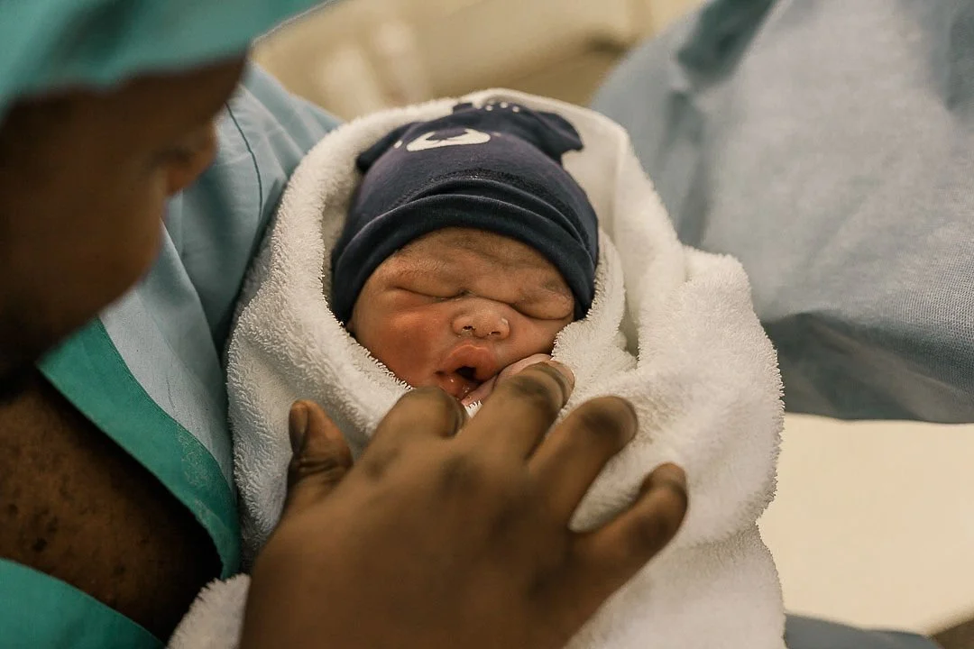 Birth doula supporting laboring mother during hospital birth in Riverside County.
