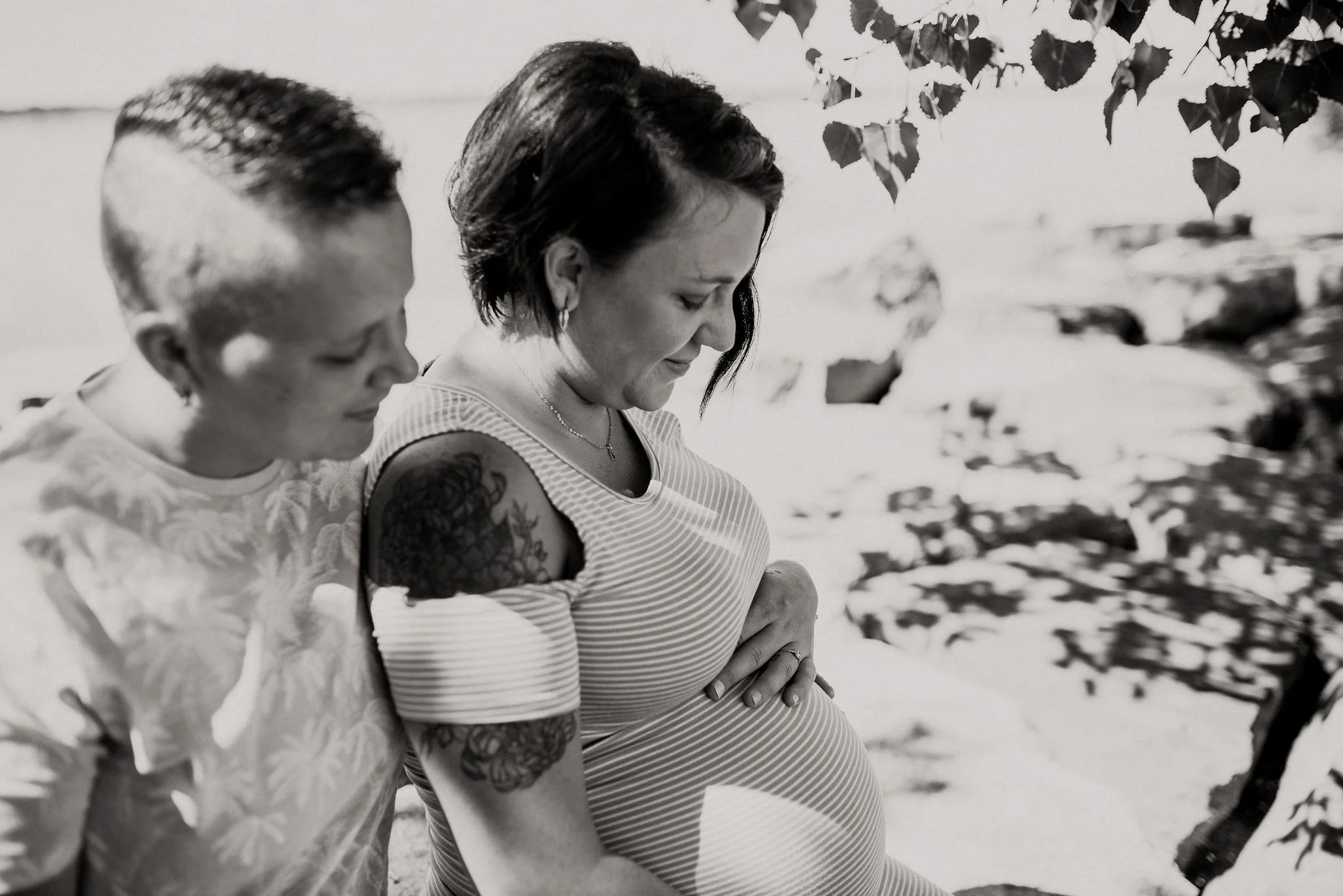 Birth doula providing hands-on support and encouragement during VBAC labor