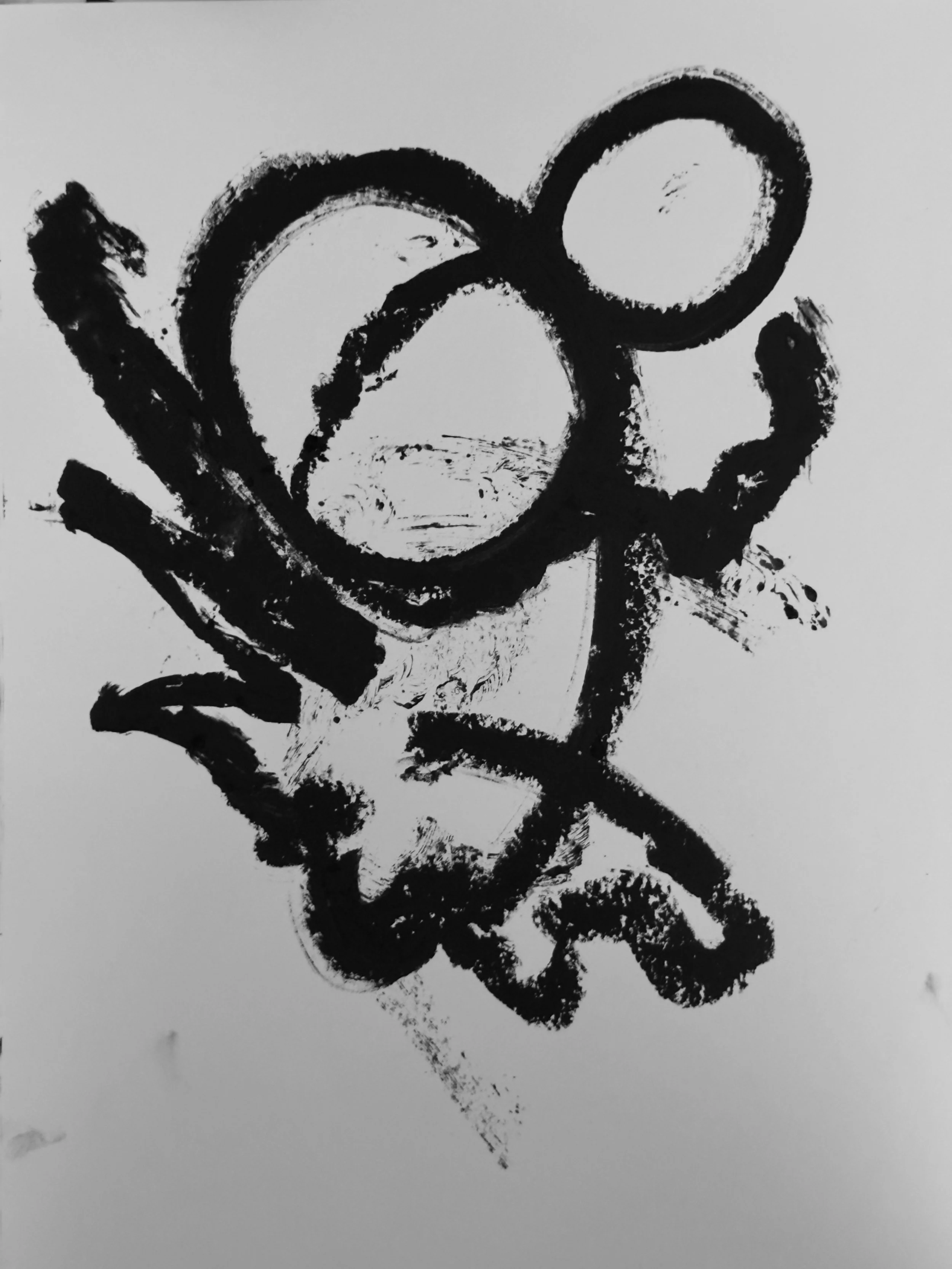 Black oil pastel drawing on white paper, featuring a playful abstract figure composed of bold, looping strokes. The composition suggests motion, spontaneity, and a sense of joyful immediacy.