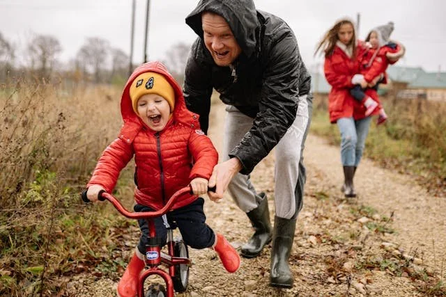 father-teaching-his-son-how-to-ride-a-bike