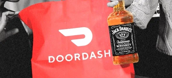 A red DoorDash bag with a Jack Daniel's whiskey bottle inside. Production still from DoorDash commercial.