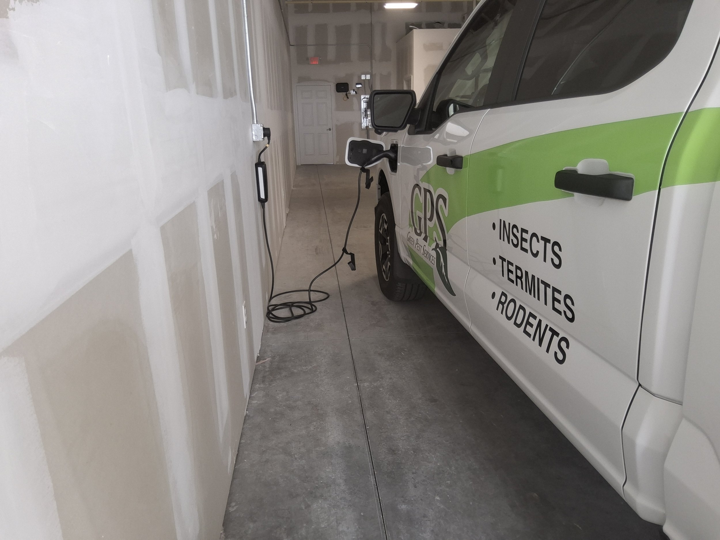 Convenient charging location beside company vehicle