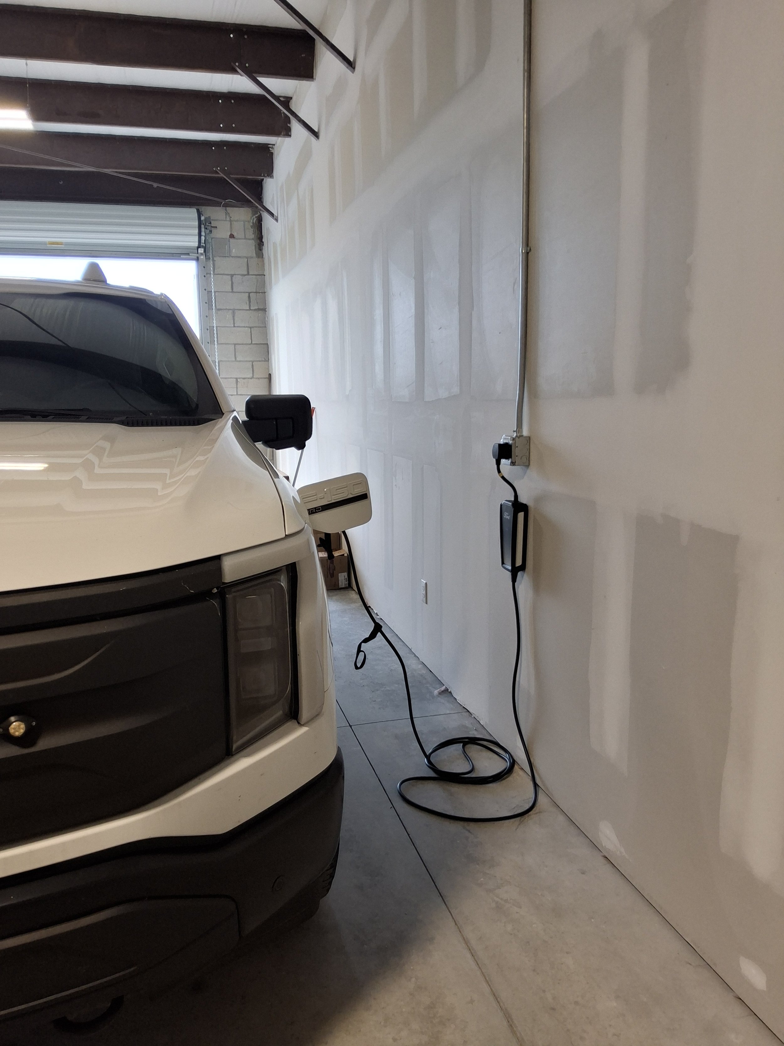 Commercial EV charger installed inside a garage for a business in Port St Lucie, FL
