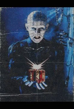 Pinhead from Hellraiser holding the Lament Configuration puzzle box on the promotional movie poster