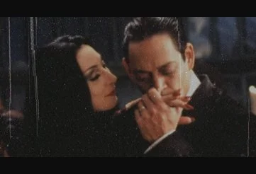 The romantic Gomez and Morticia Addams in The Addams Family
