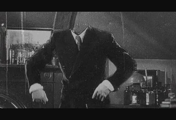 Dr. Jack Griffin revealing himself to the suspicious locals in The Invisible Man