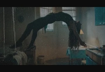 Maud levitating in a backbend position in Saint Maud