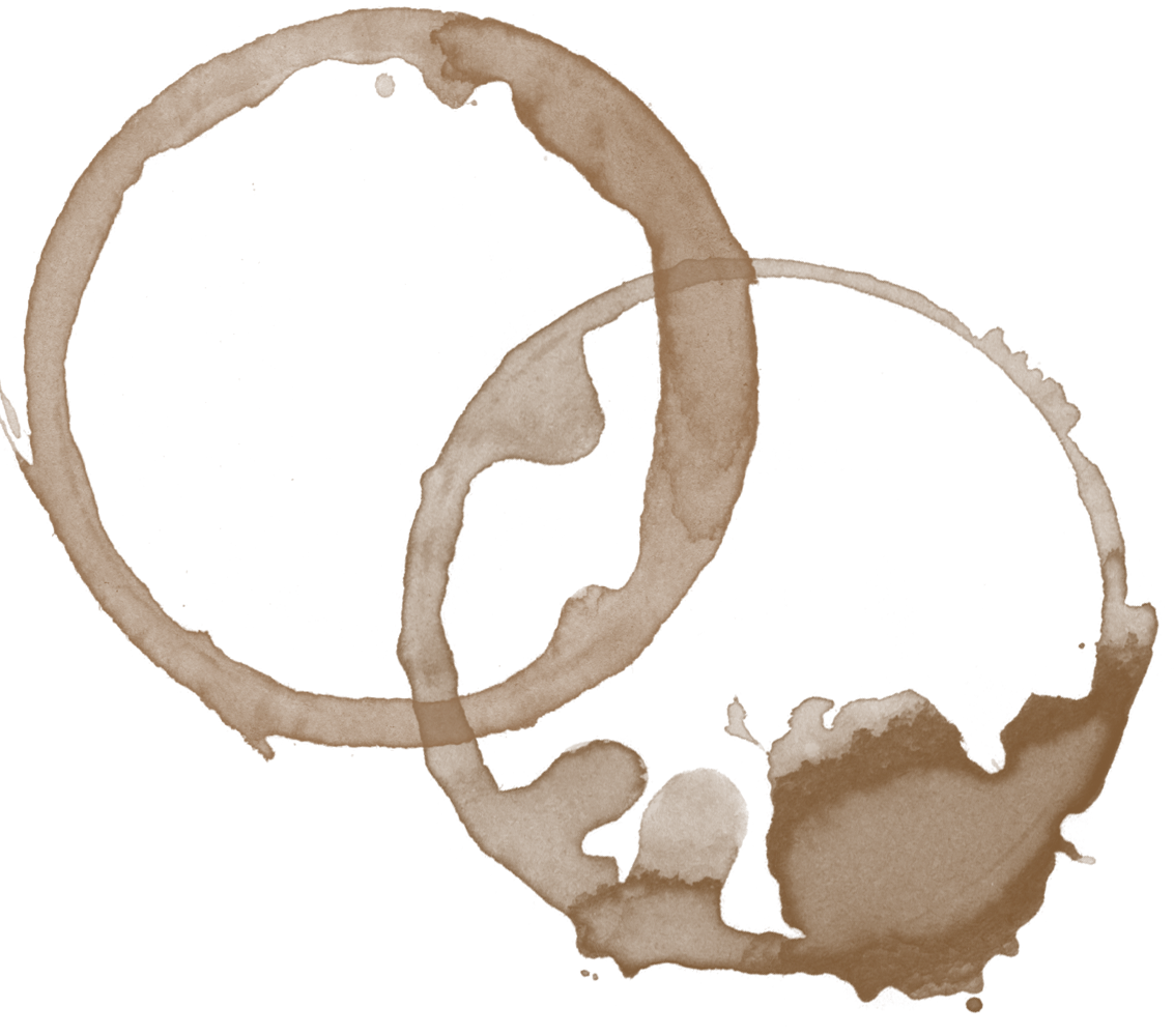 Two coffee cup stains on a beige surface, overlapping slightly.