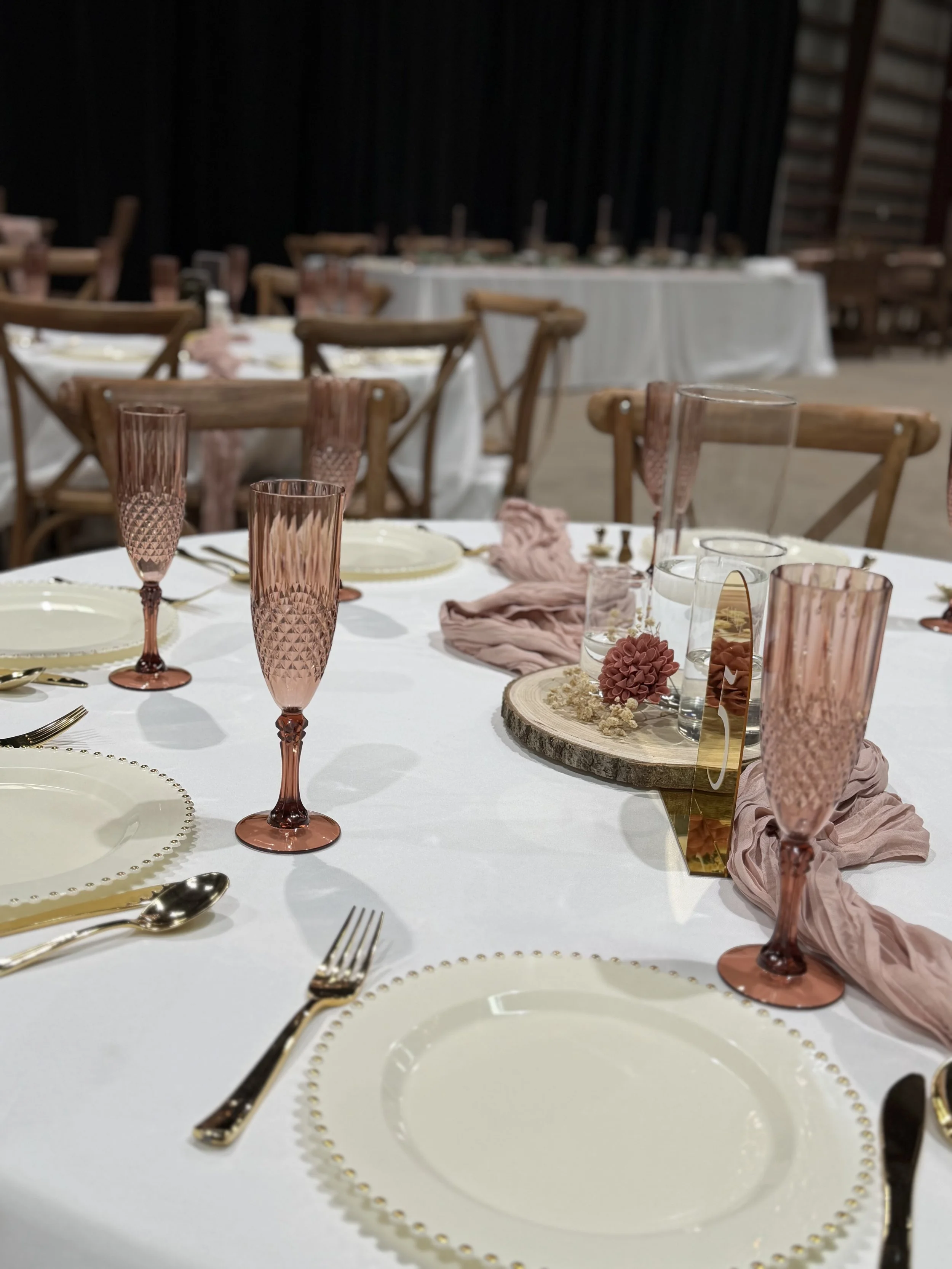 Romantic wedding tablescape inside an industrial wedding venue near Amarillo