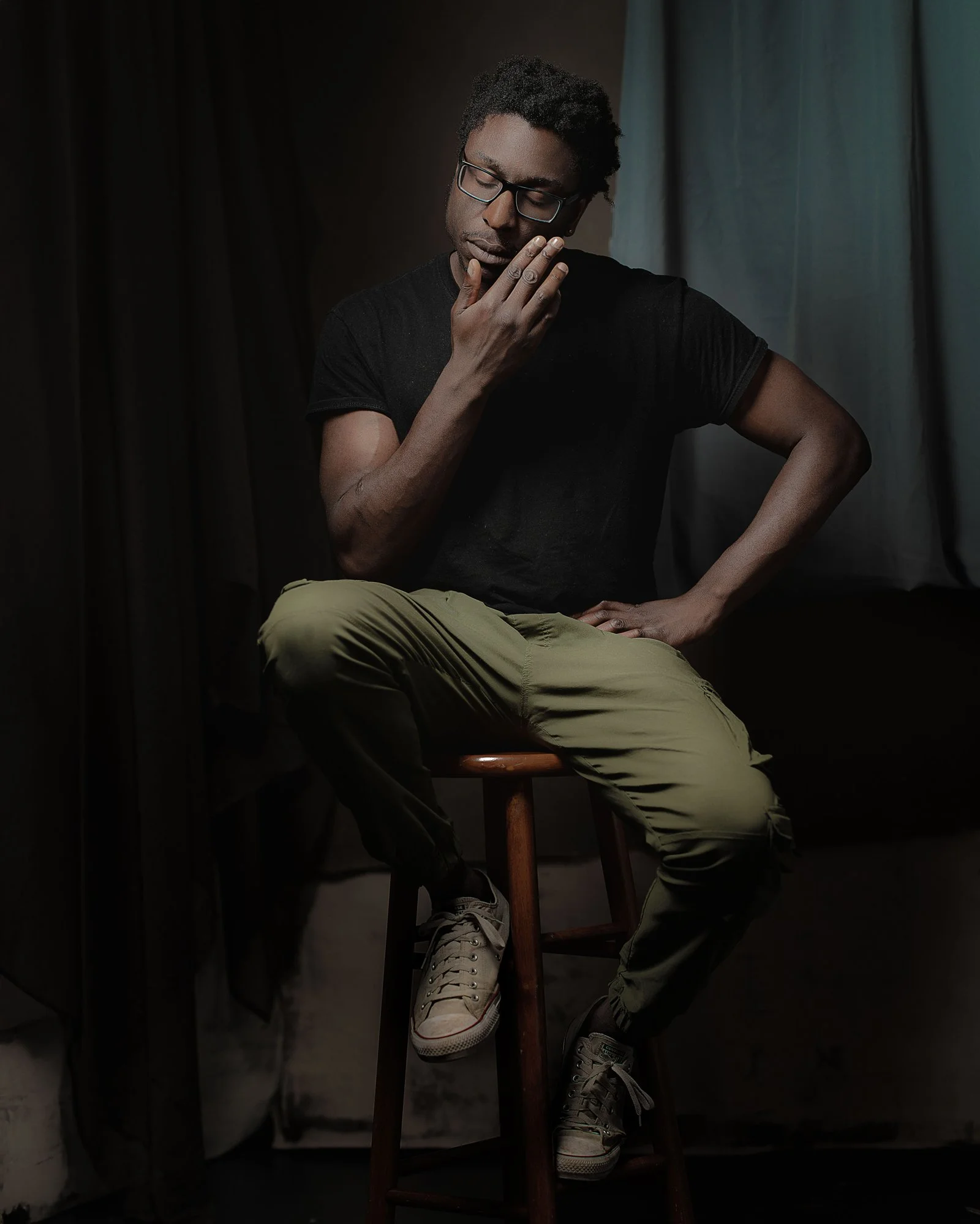 portrait of black man on stool