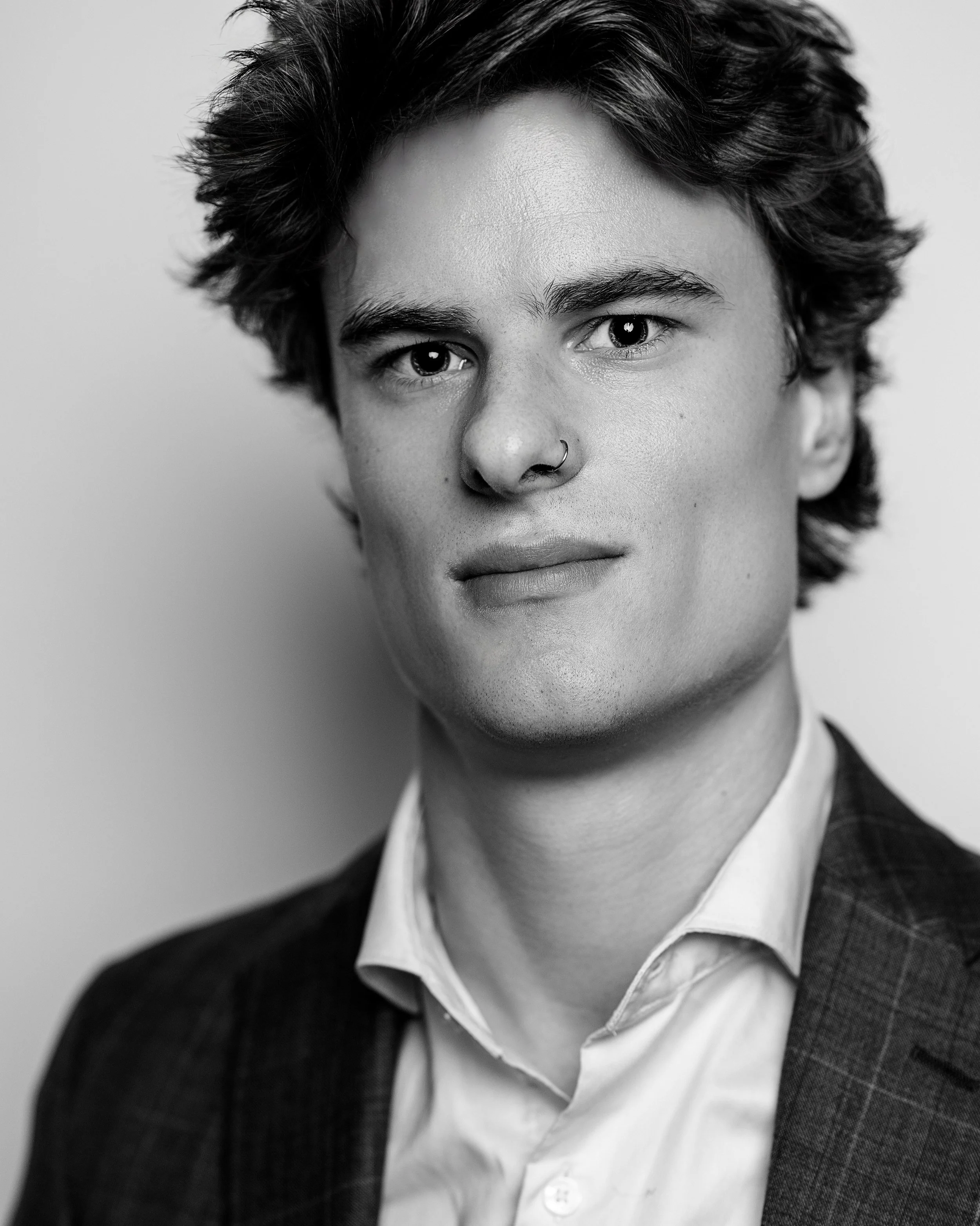 Black and white portrait of man in suit with no glasses