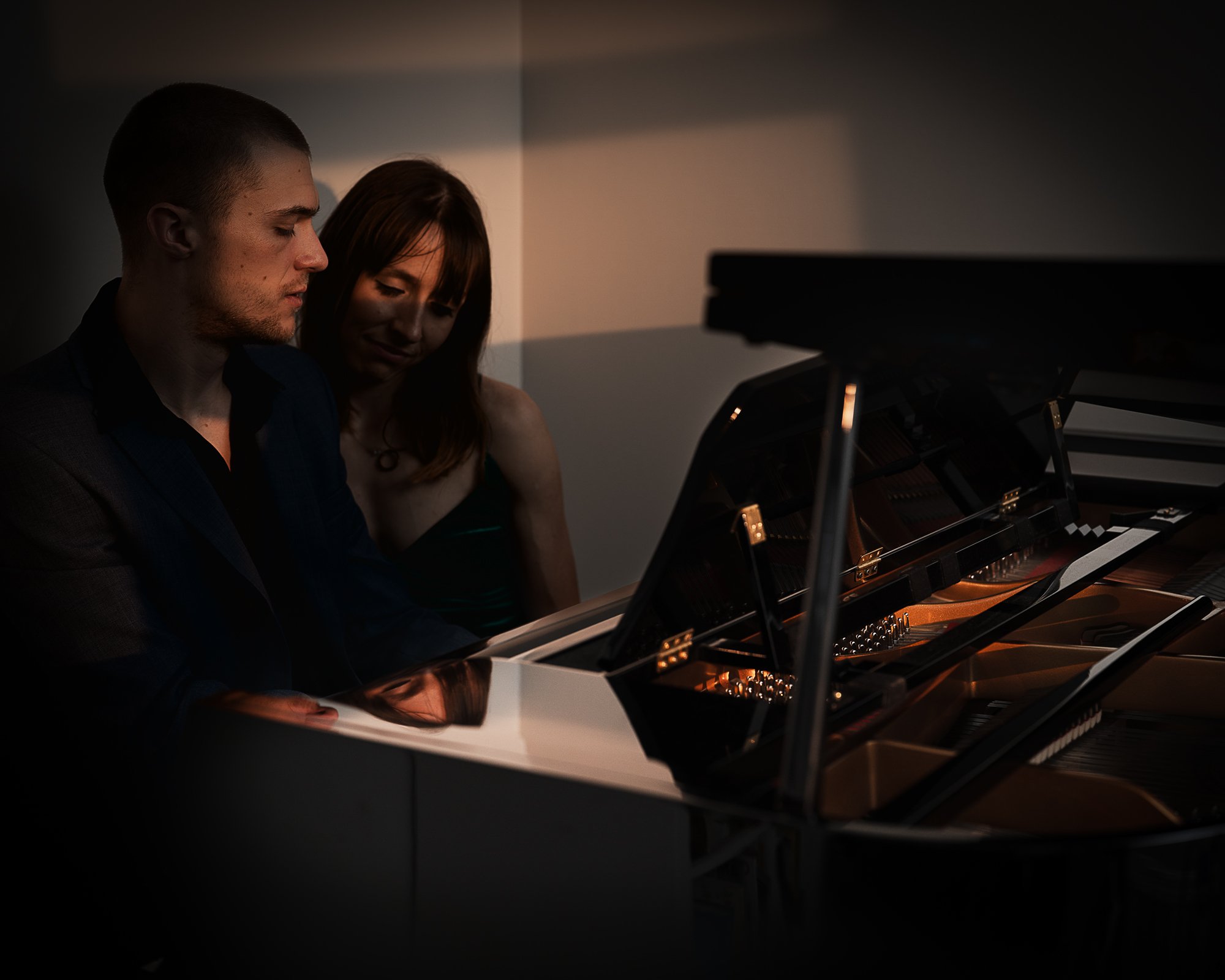 Portrait of a couple playing piano