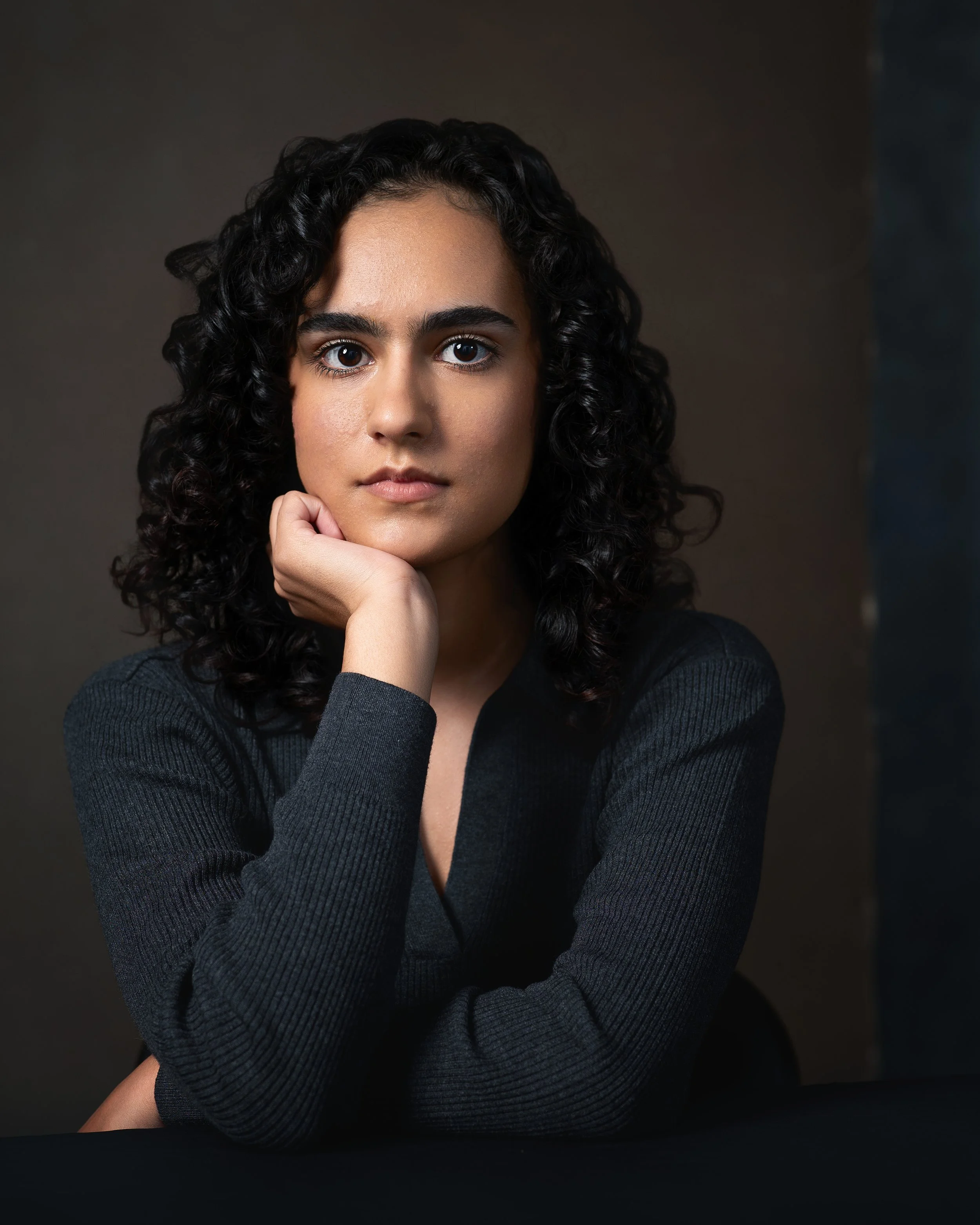portrait of woman black hair olive skin