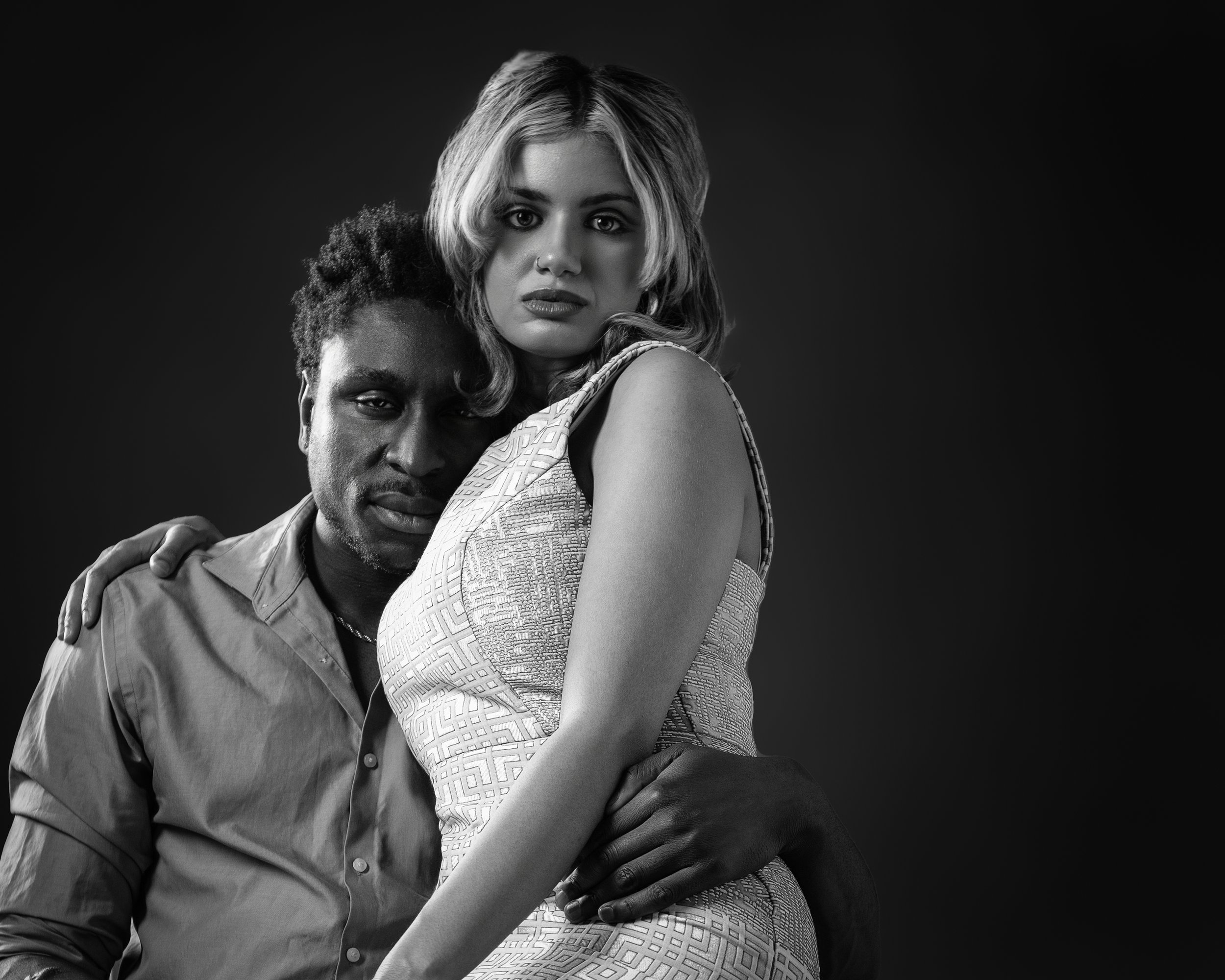 Moody black and white photo of a couple