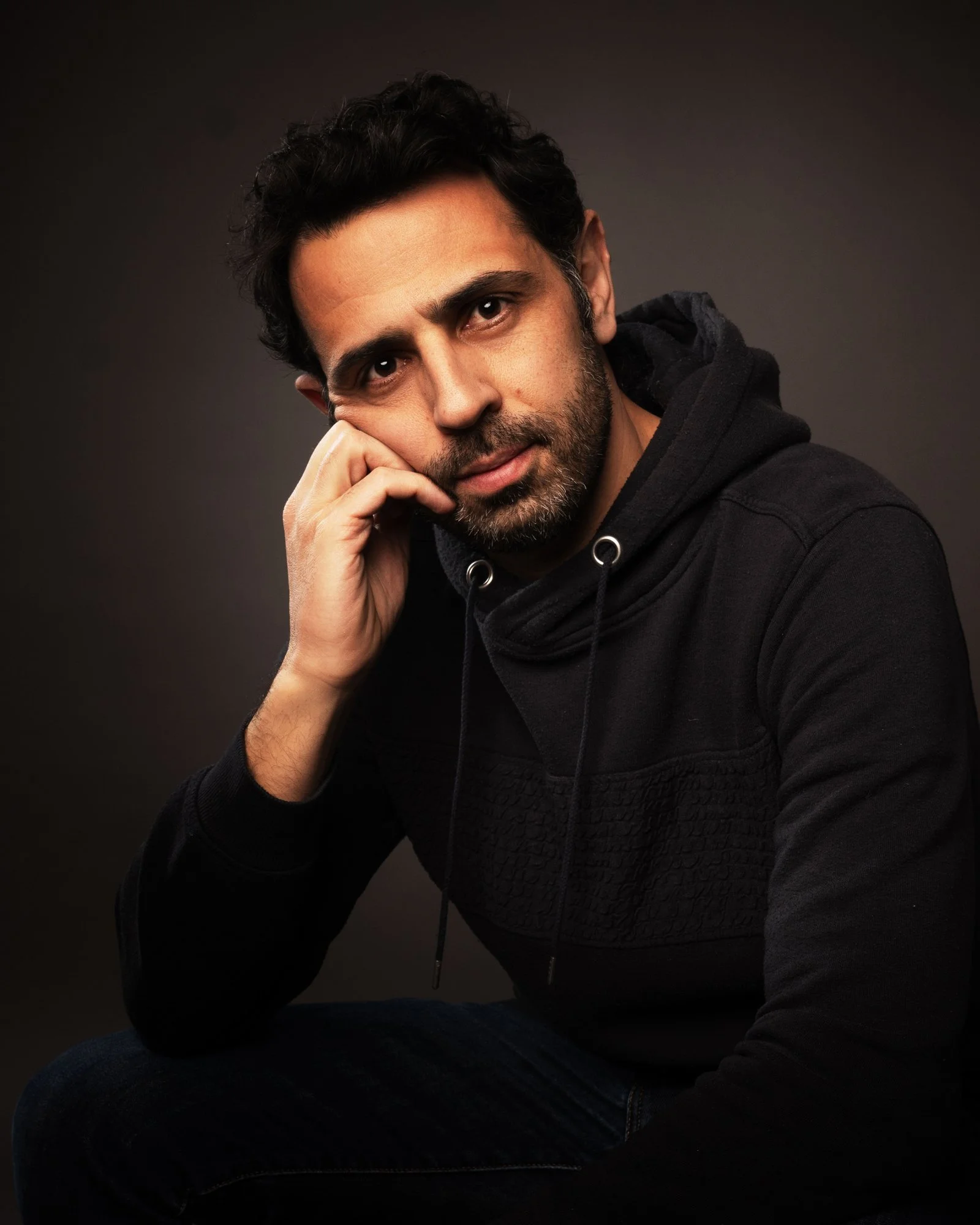 portrait of man leaning on hand