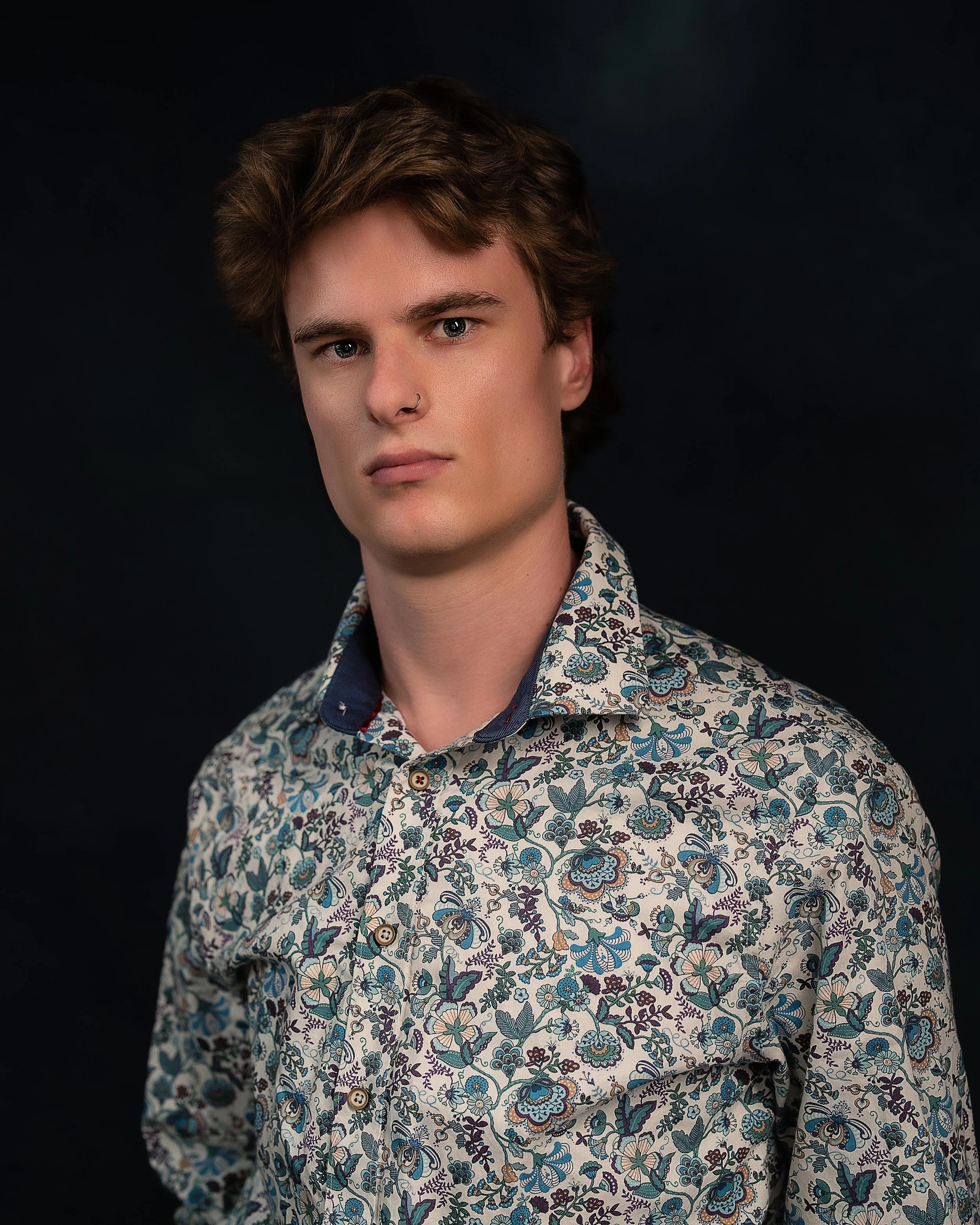 portrait of man in patterned shirt