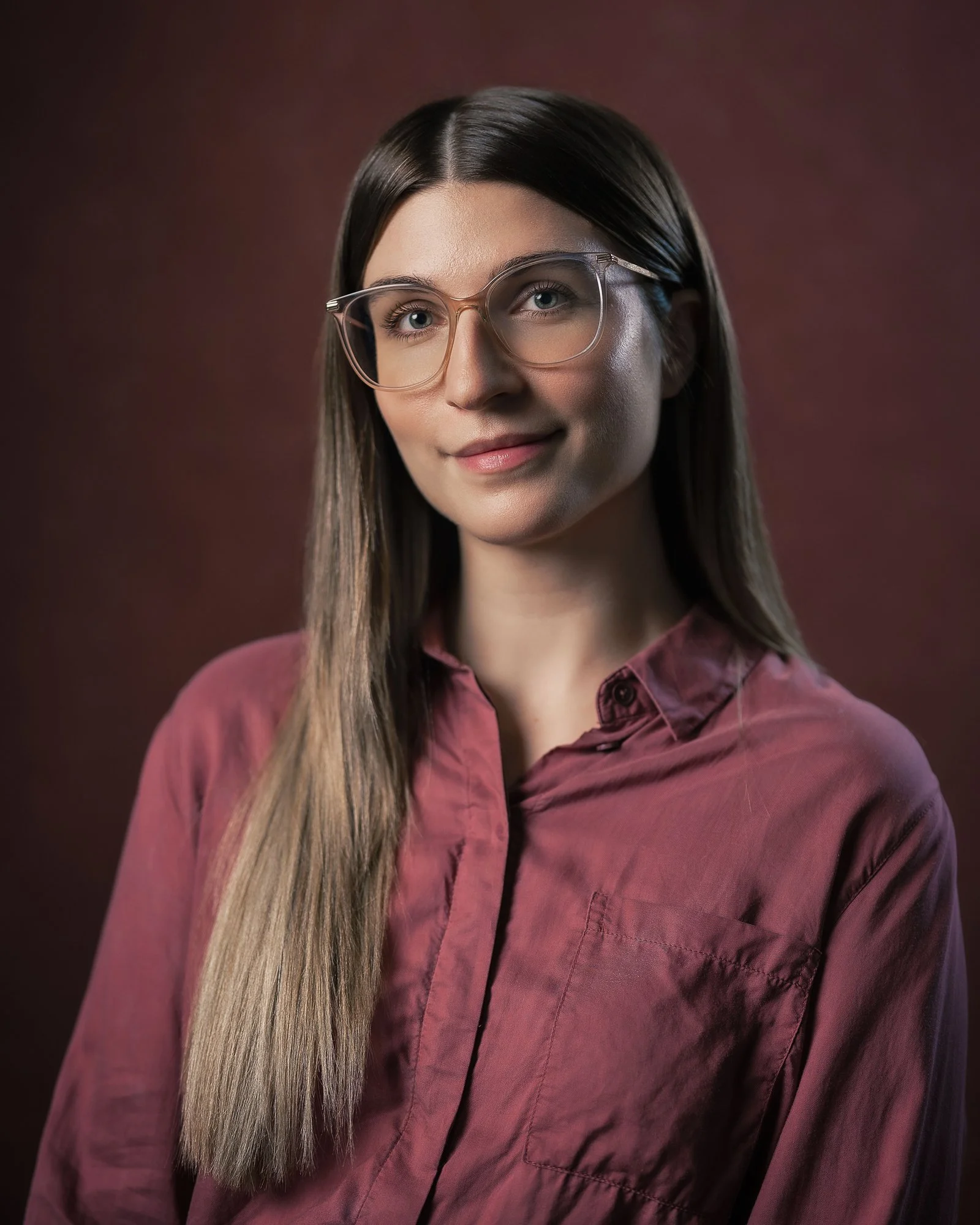 portrait of woman burgundy red and glasses