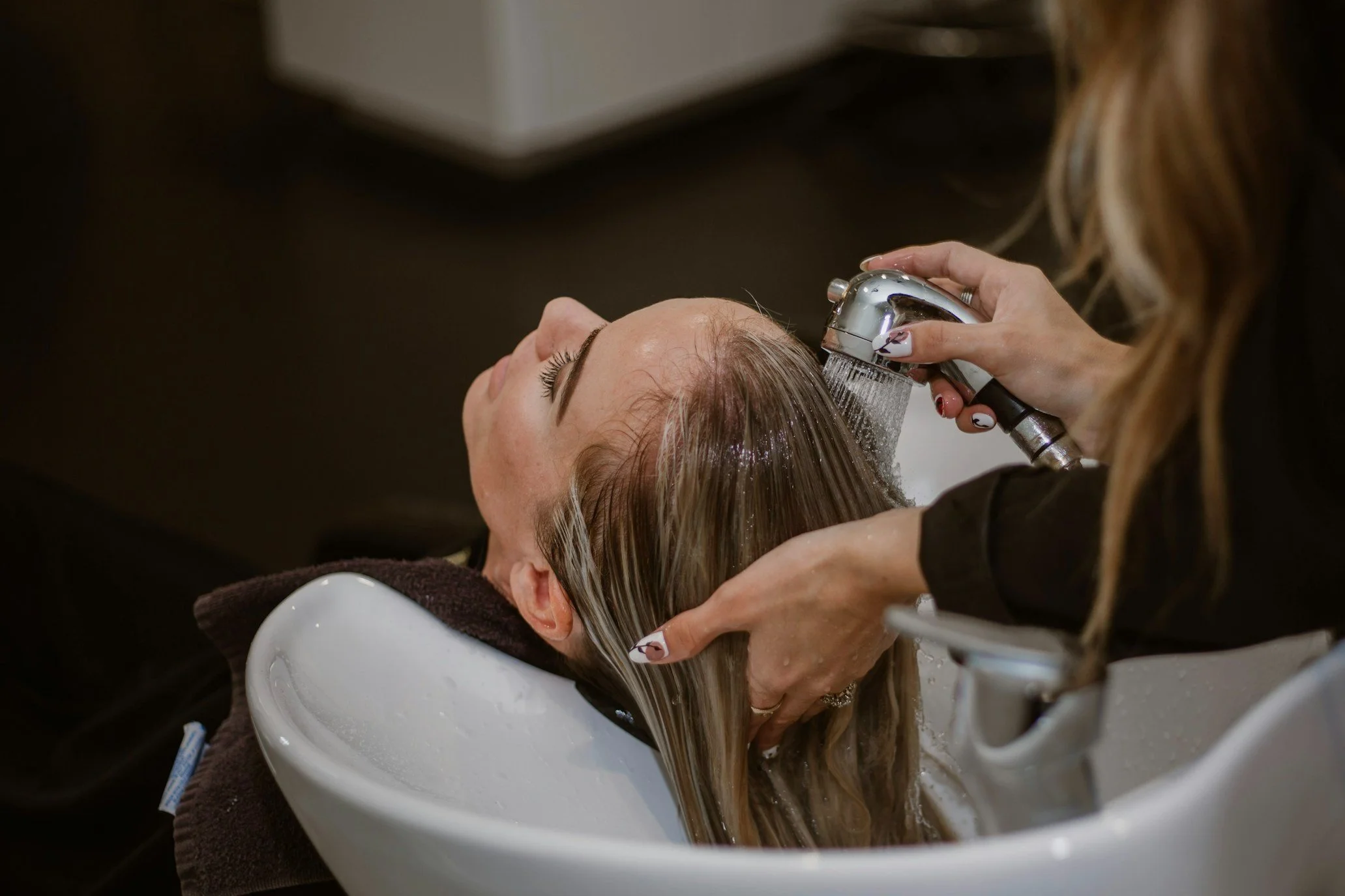 woman getting her hair washed