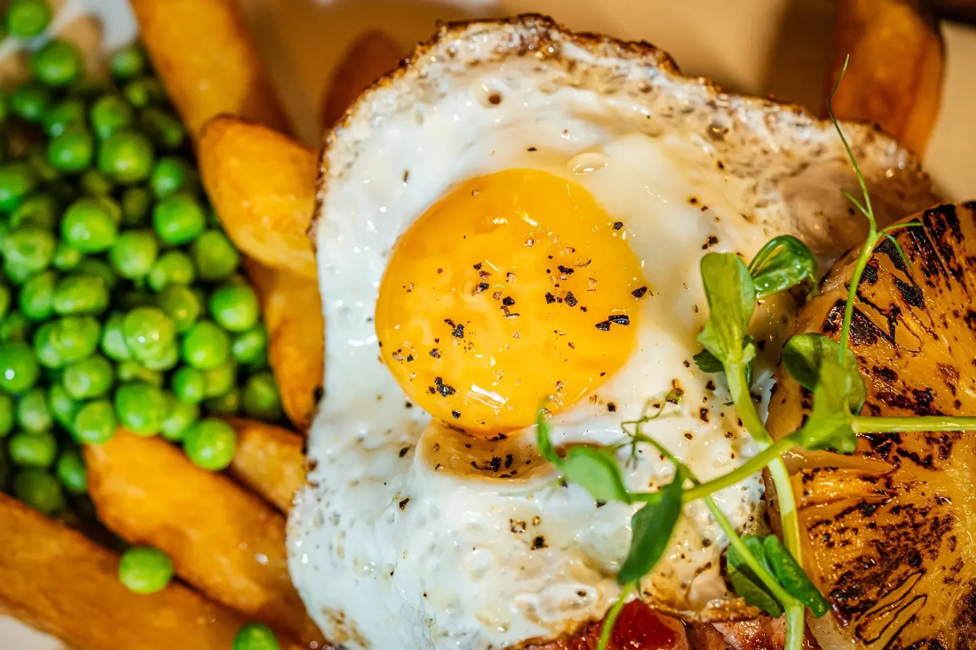 egg-and-chips-with-peas-and-grilled-pineapple.webp