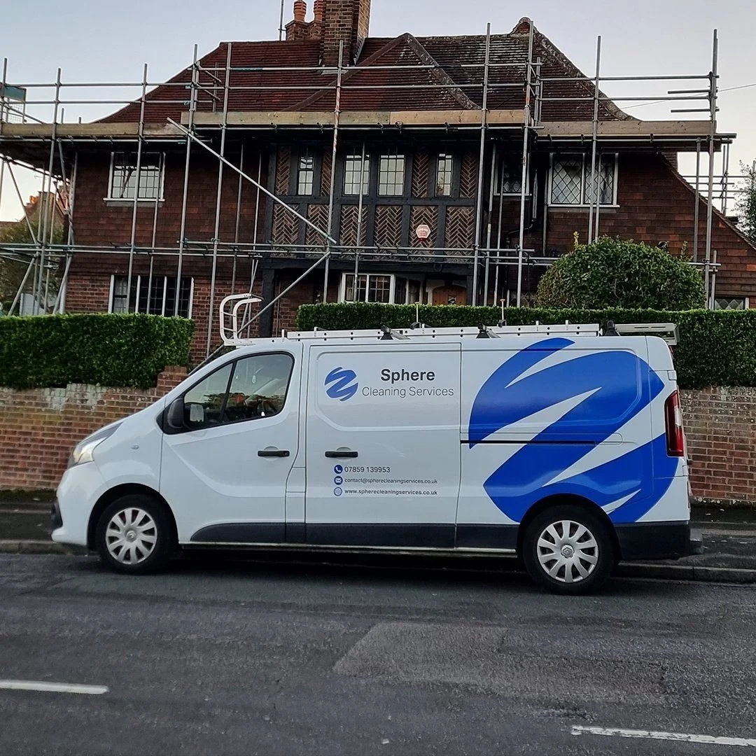 Sphere Cleaning Services van outside large residential property with scaffold erected for roof cleaning