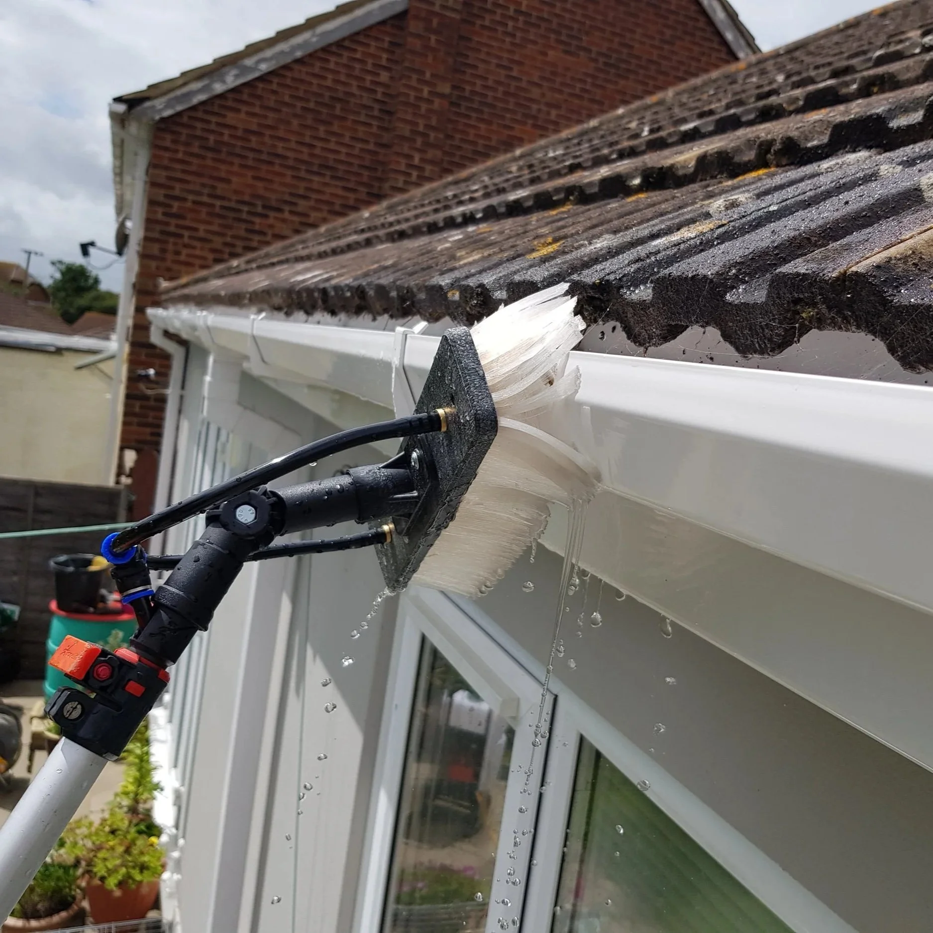 Fascia and soffit cleaning using pure water fed pole system on gutters— Sphere Cleaning Services