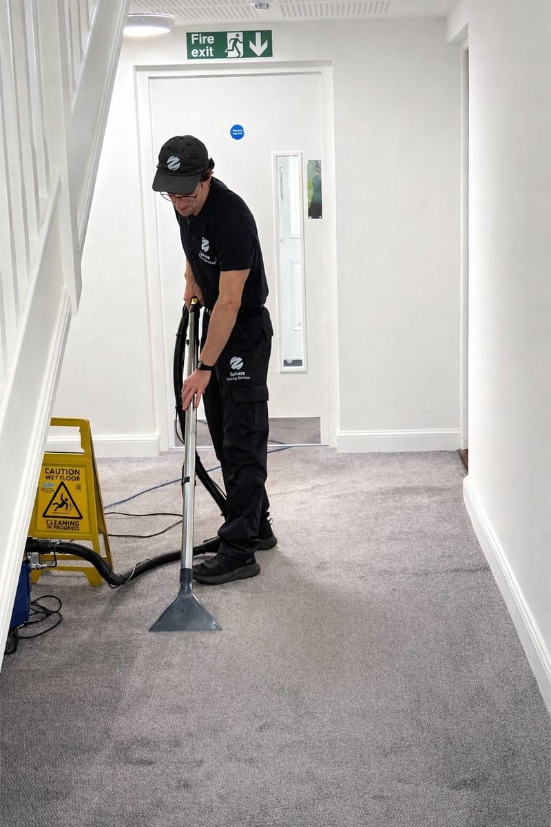 Sphere Cleaning Services operative carpet cleaning a communal corridor in a residential block