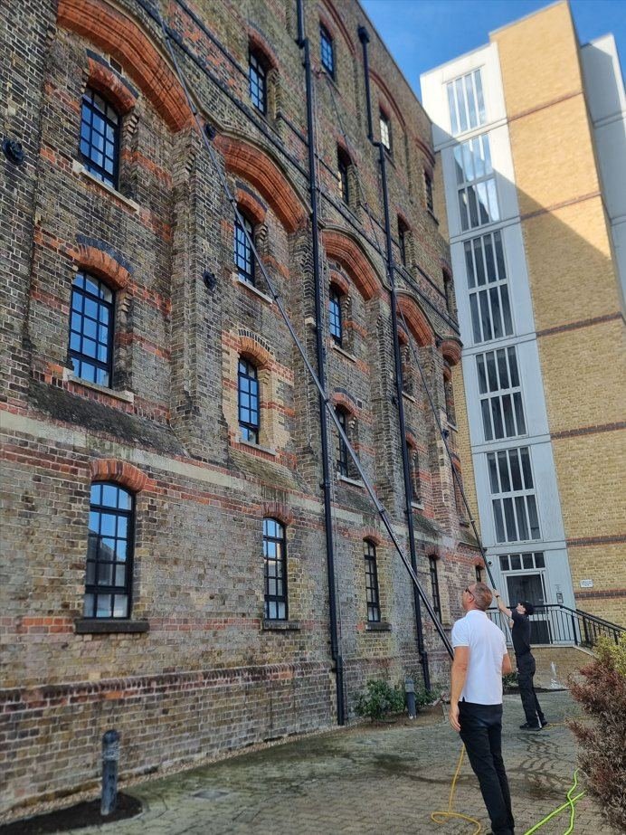 High-reach window cleaning on a multi-storey Victorian building in Canterbury
