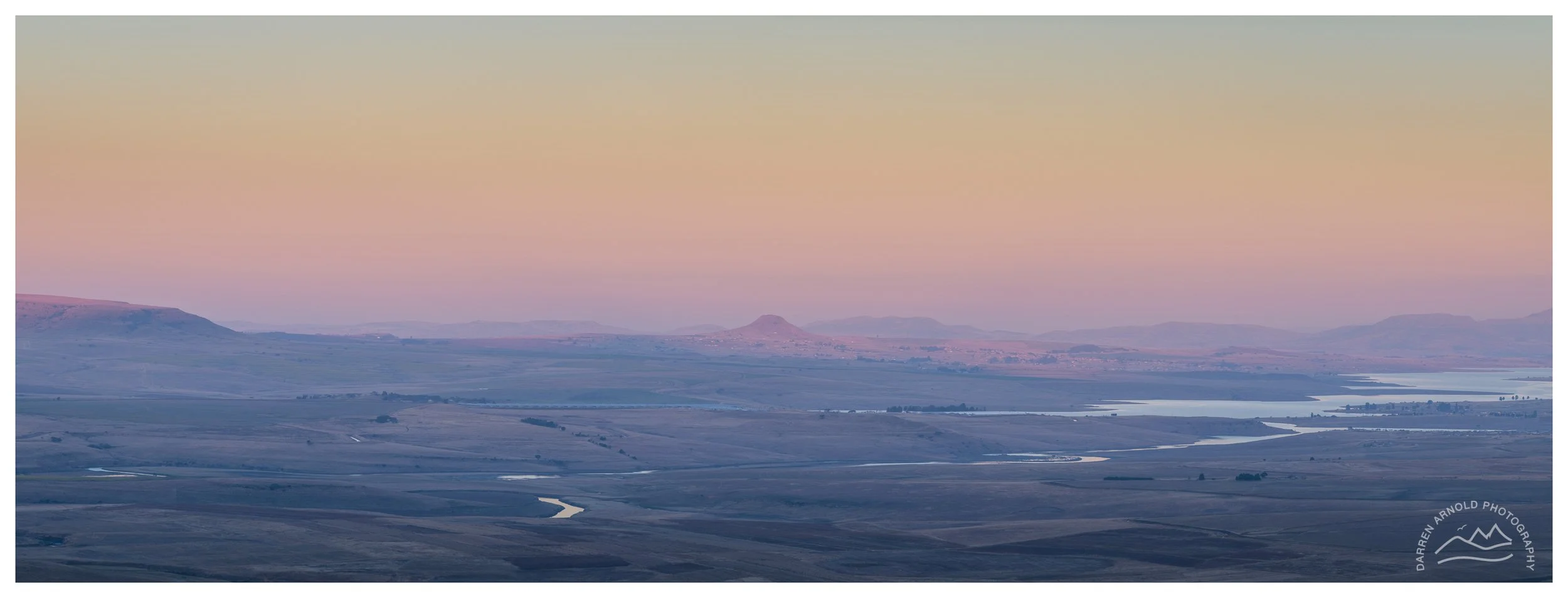 This is a three image panorama, from the Drakensberg Mountains in South Africa.  The shot was taken in a rush as the light was rapidly disappearing.
