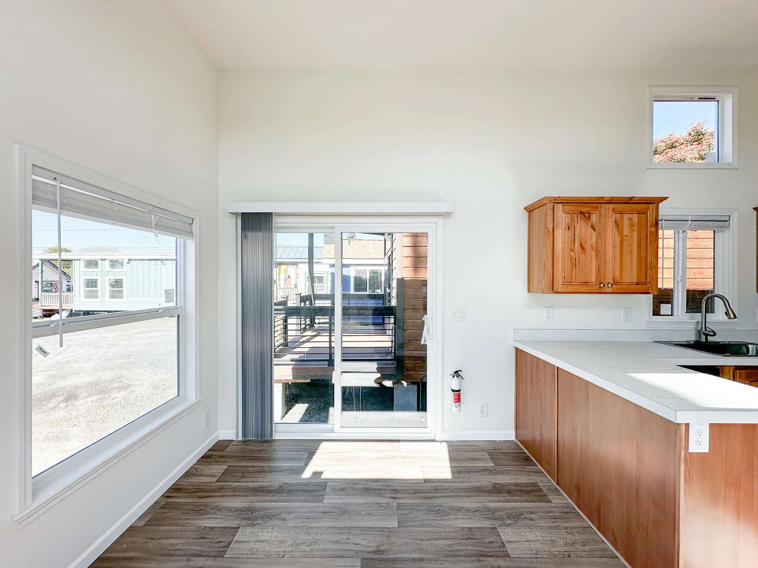 Sliding glass door entry on kitchen side of home