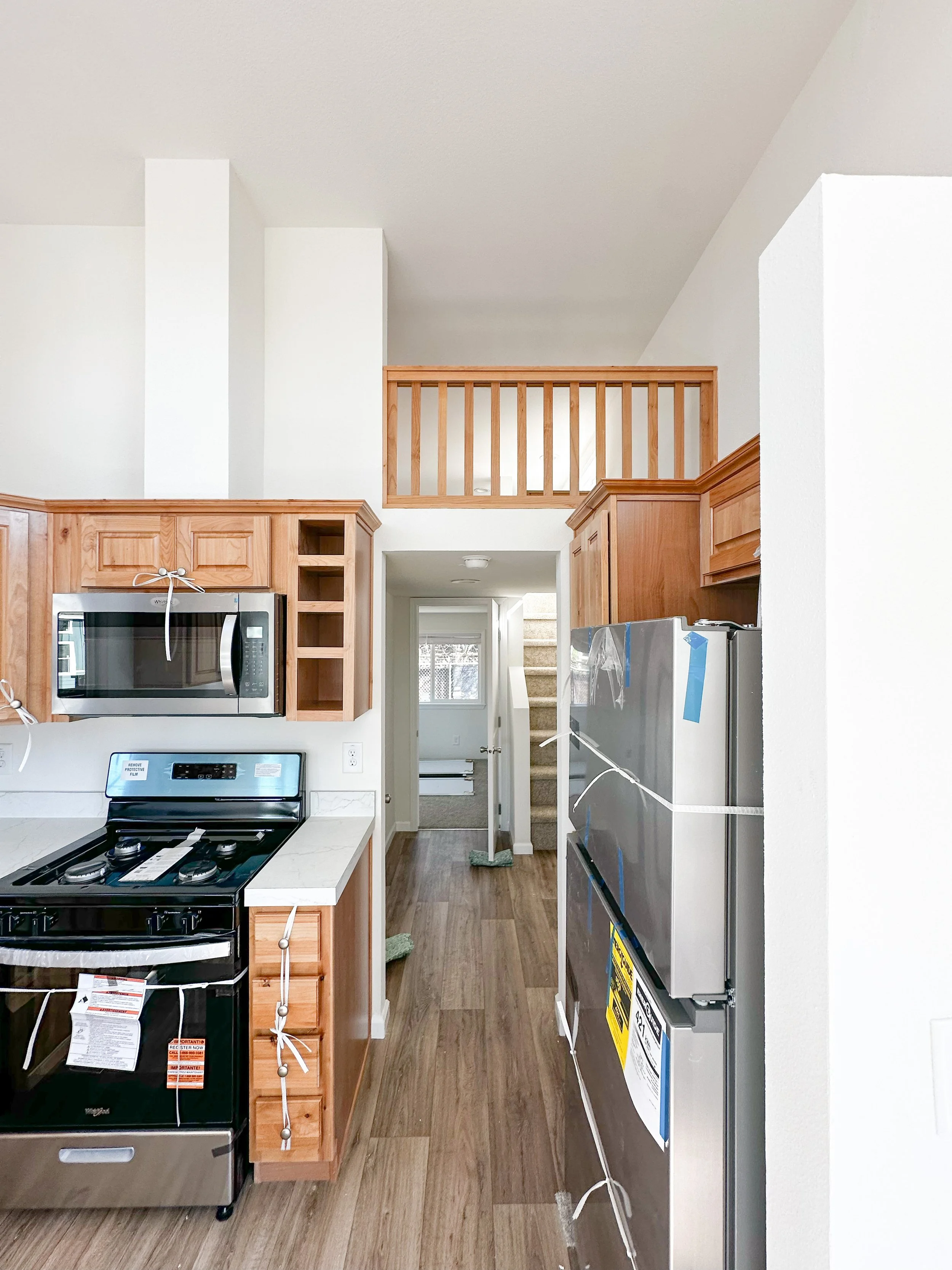 Kitchen looking through to back hallway and bedroom