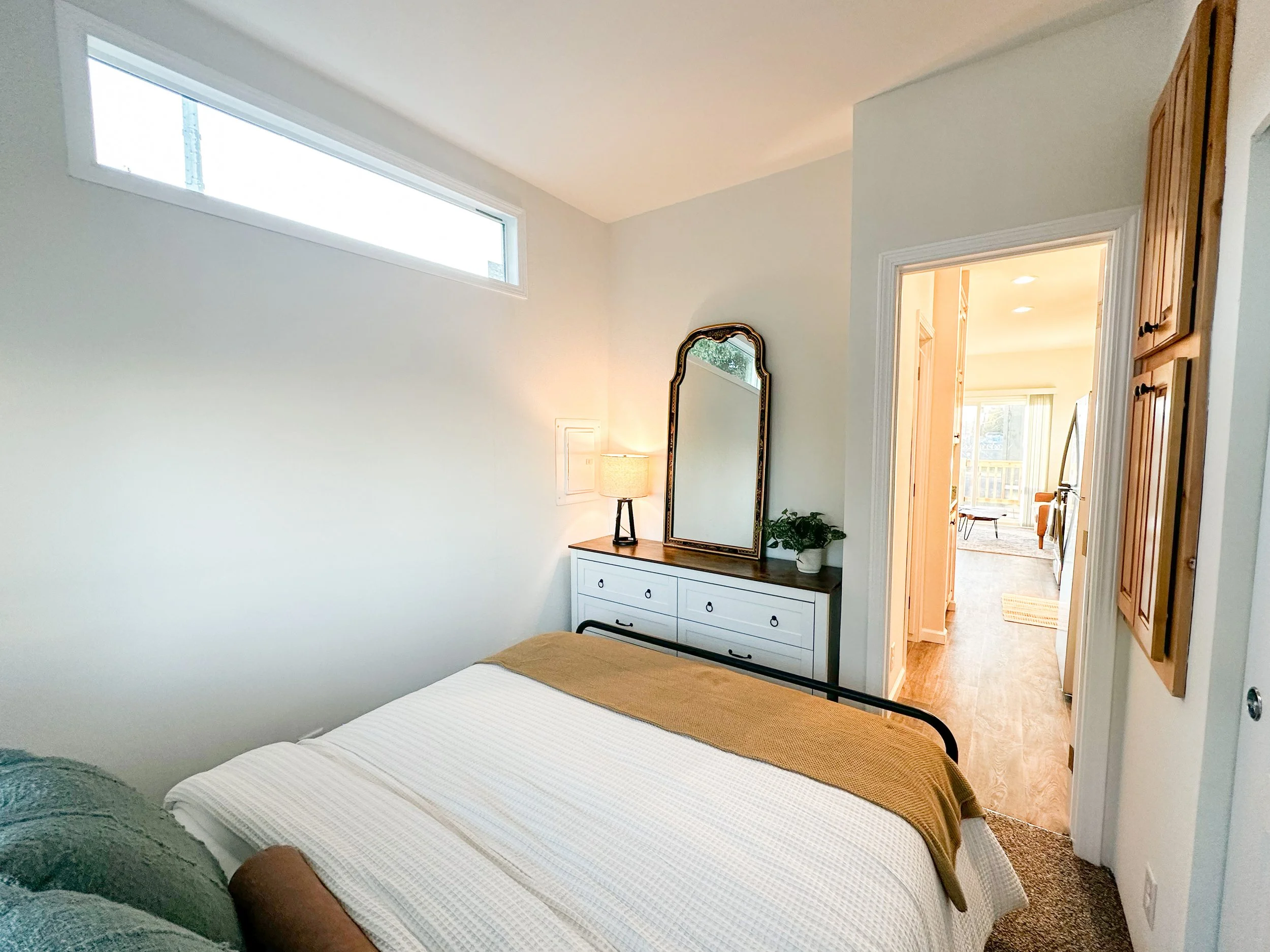 Willow bedroom with 62x15 inch transom window and dresser nook