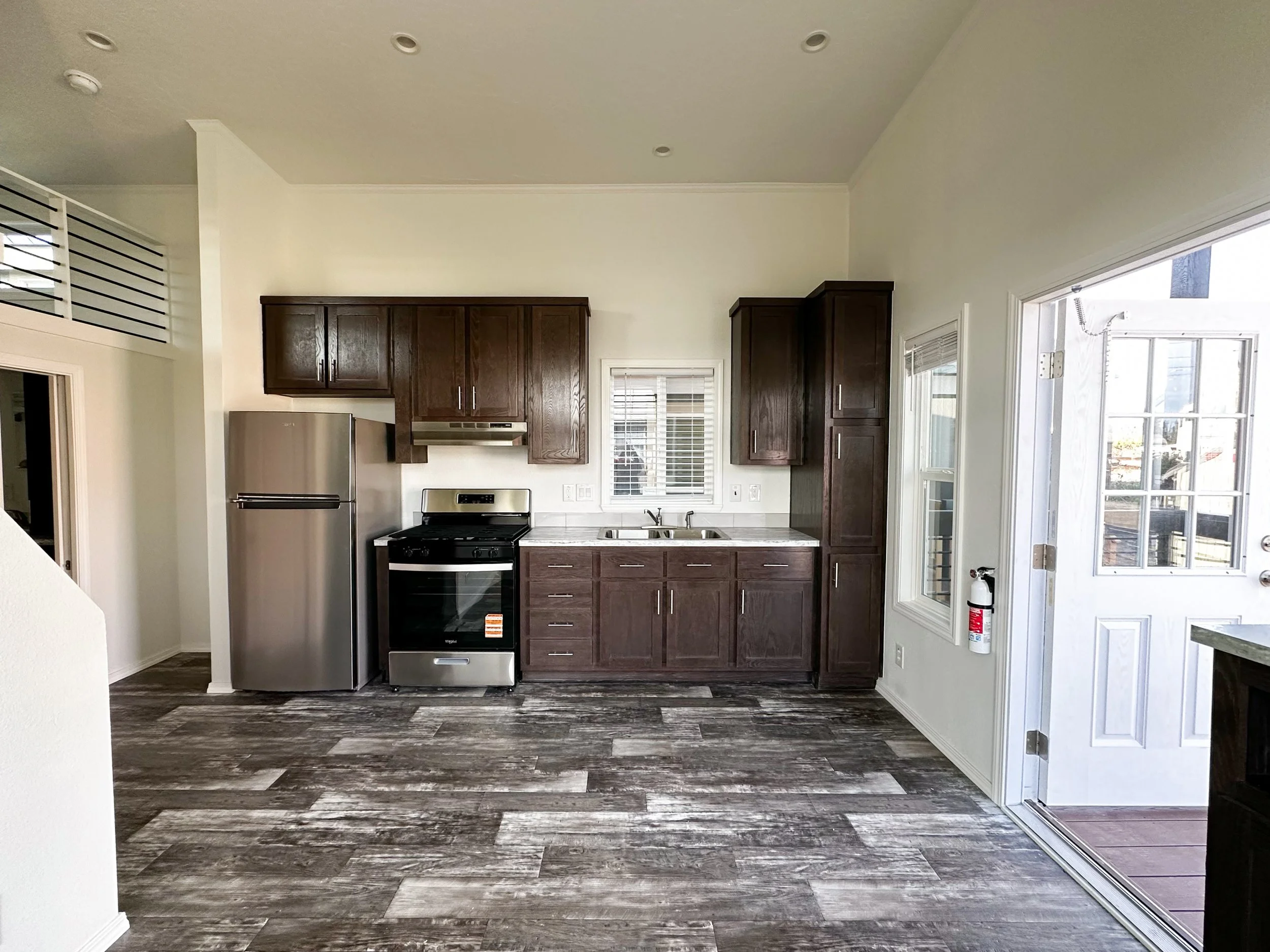 Lofted Ponderosa kitchen with Creston Oak cabinets and satin nickel pulls