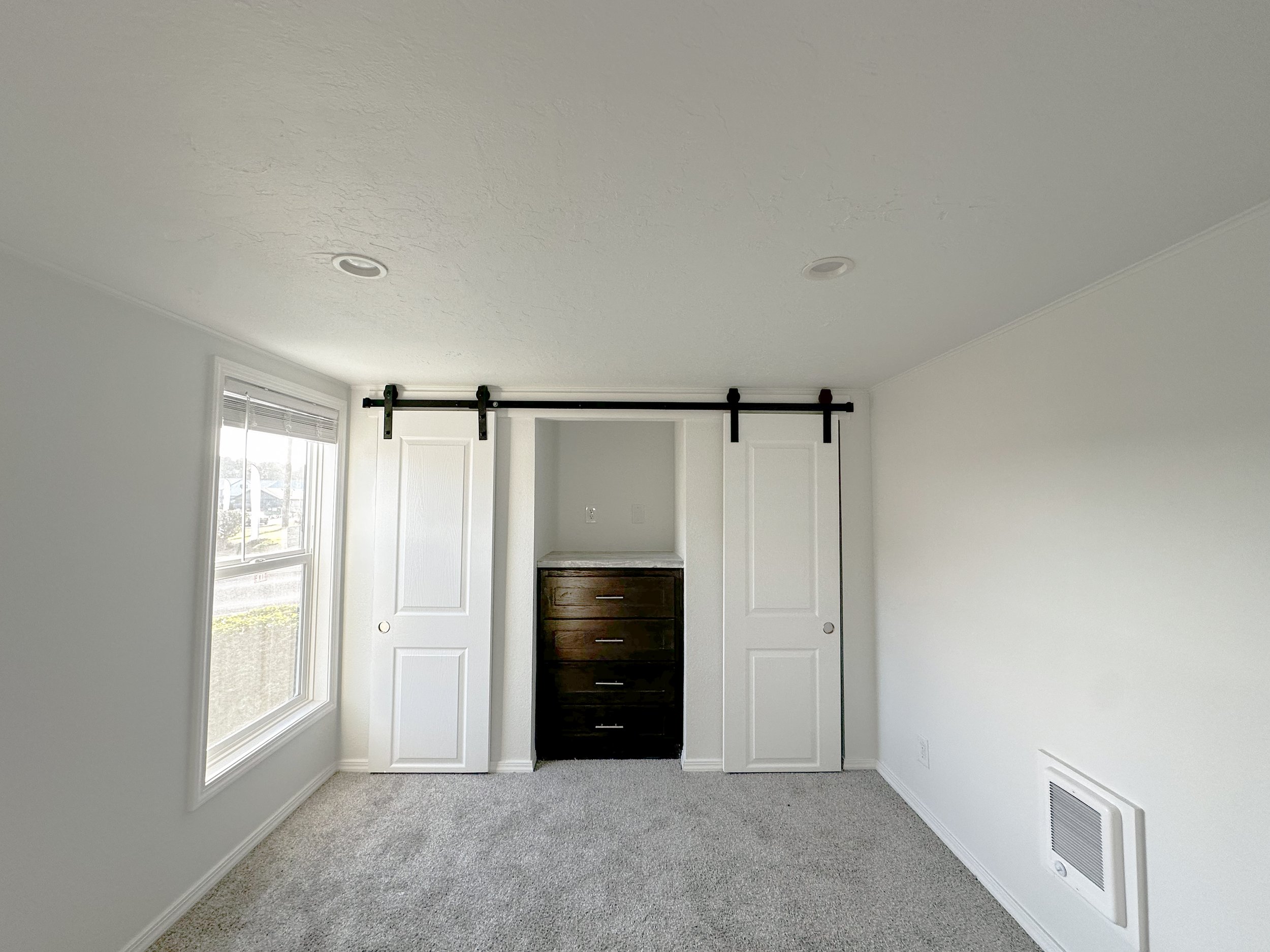 Lofted Ponderosa bedroom closet barn doors and dresser