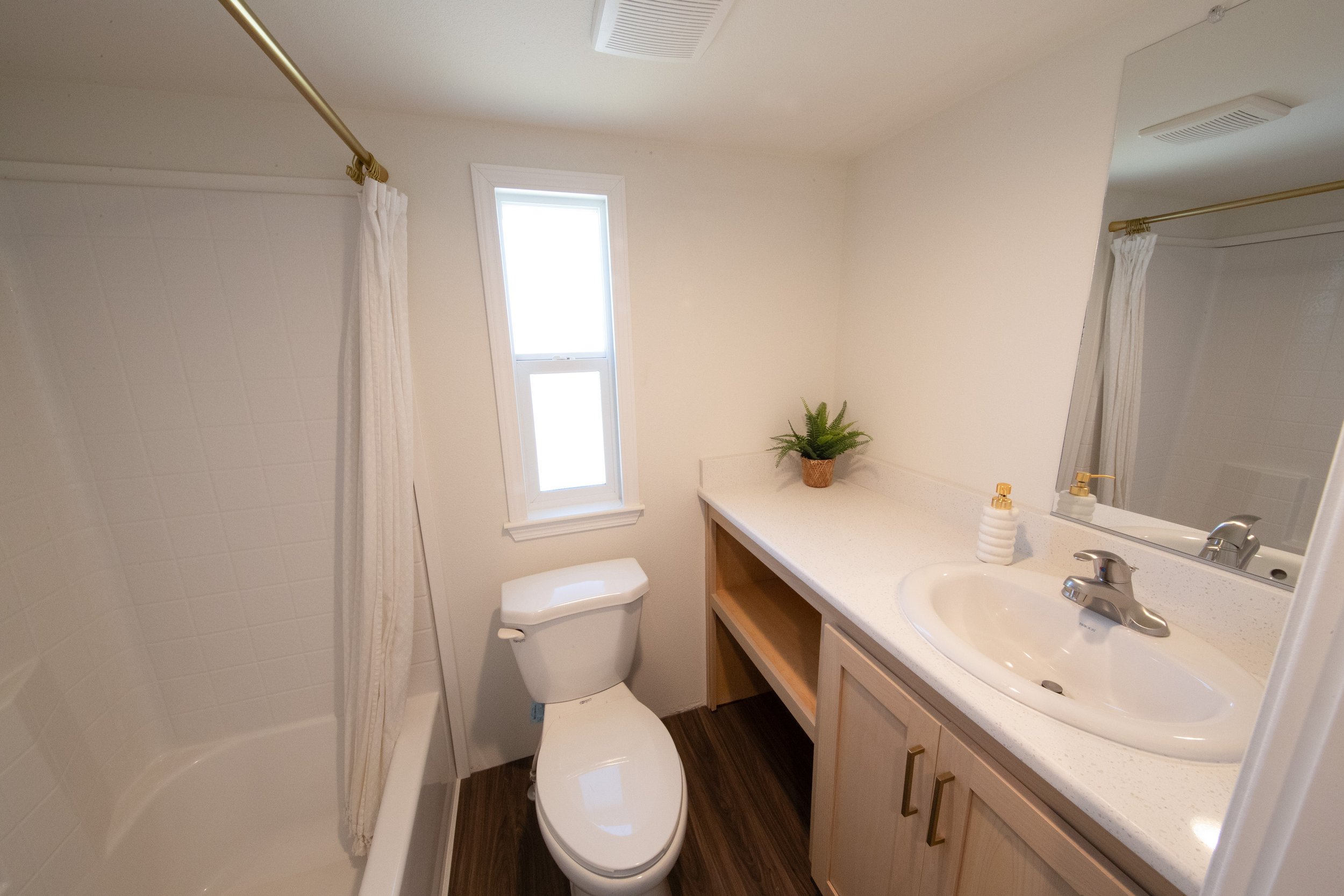 Portland Alder model bathroom with shower/tub combo and added window