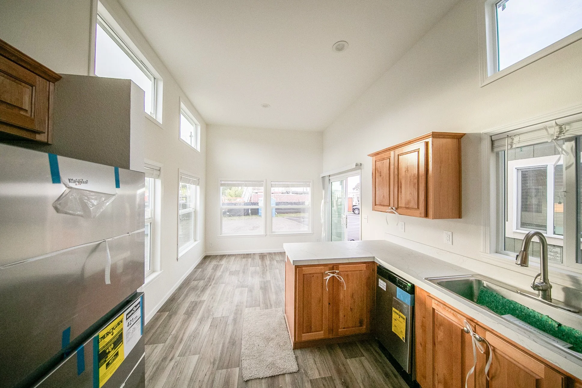 View from hallway into kitchen and living room